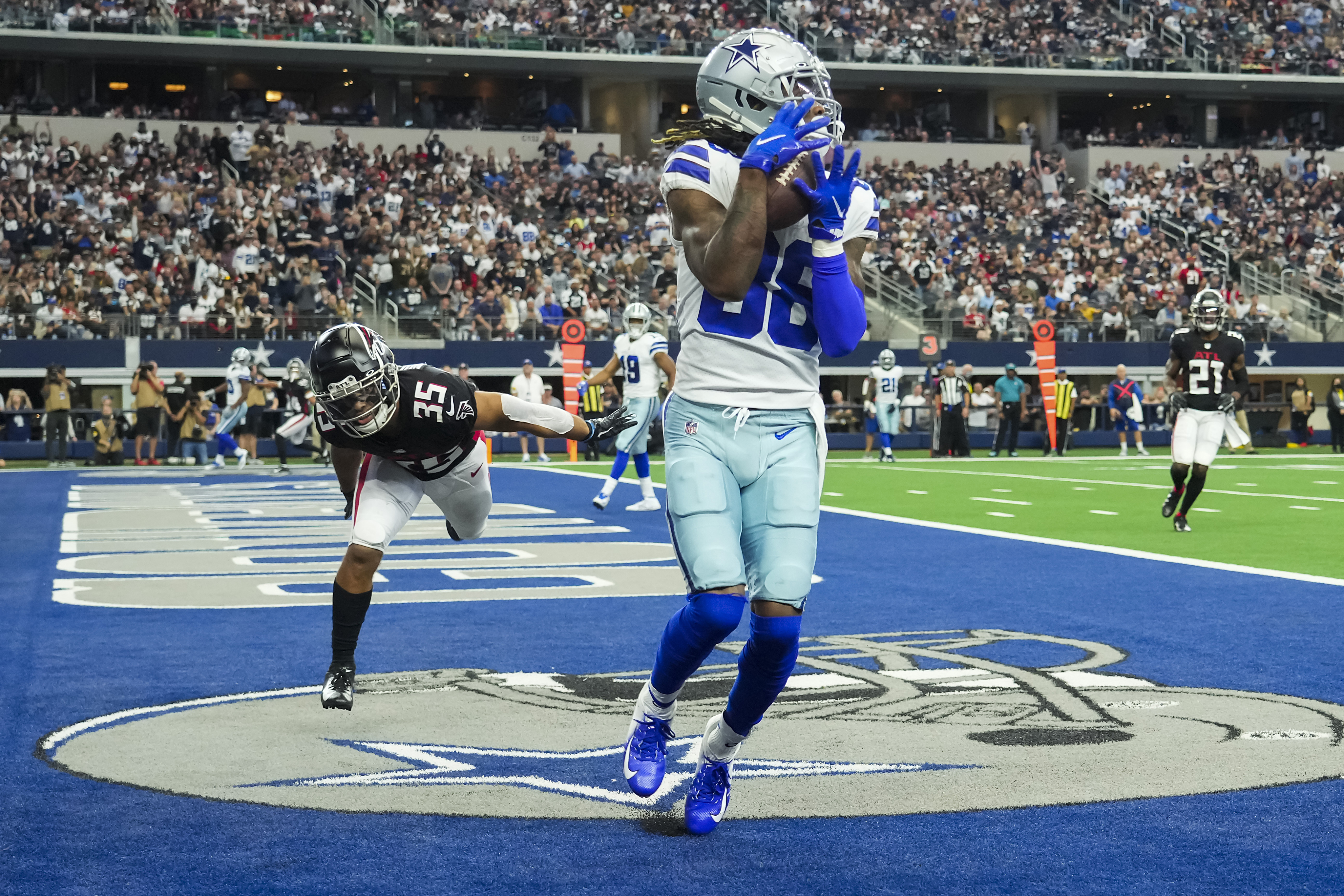 Dallas Cowboys quarterback Dak Prescott steps off the riser after