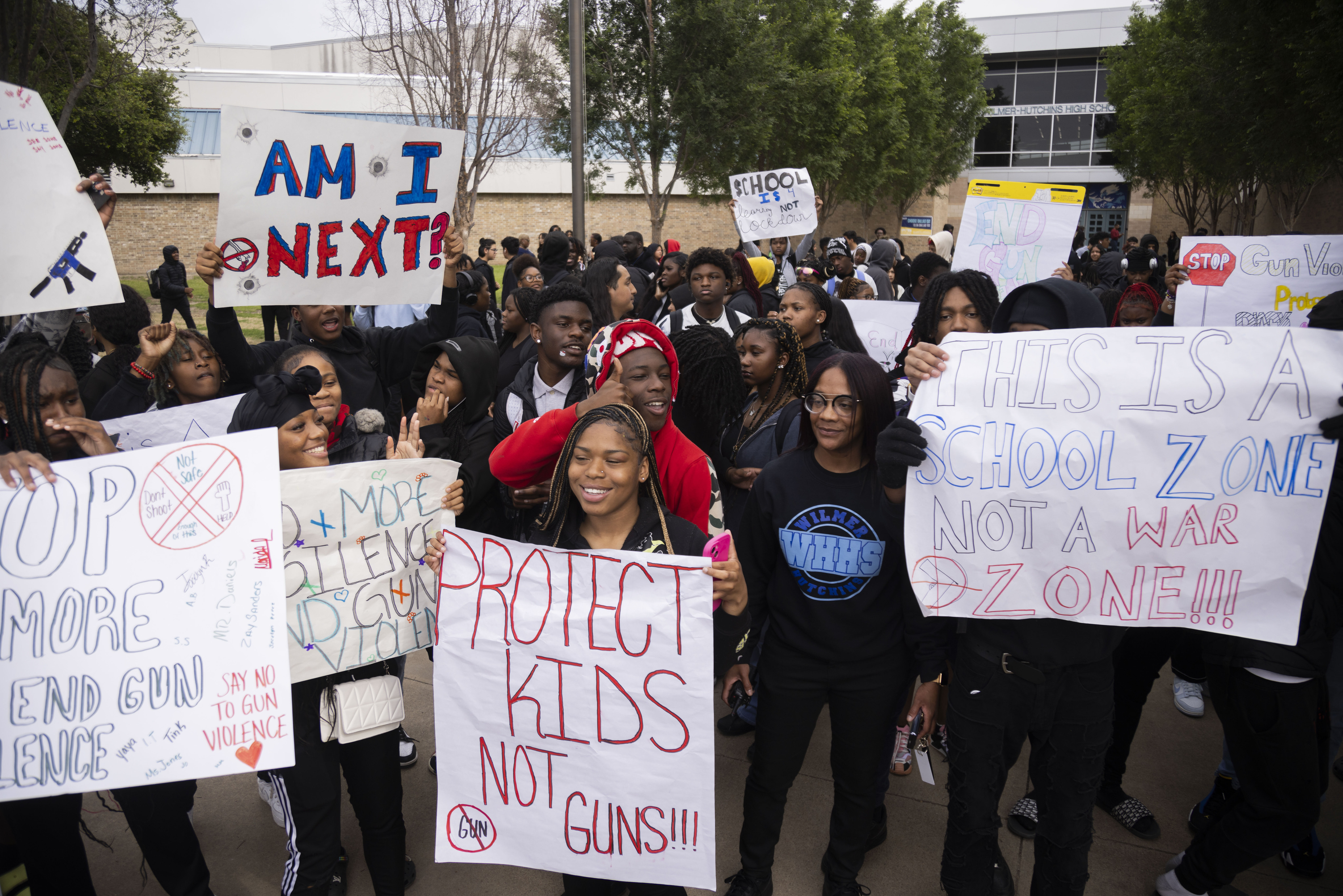 Principal Shadaria Foster (center right) stood with students as they staged a “walkout”...