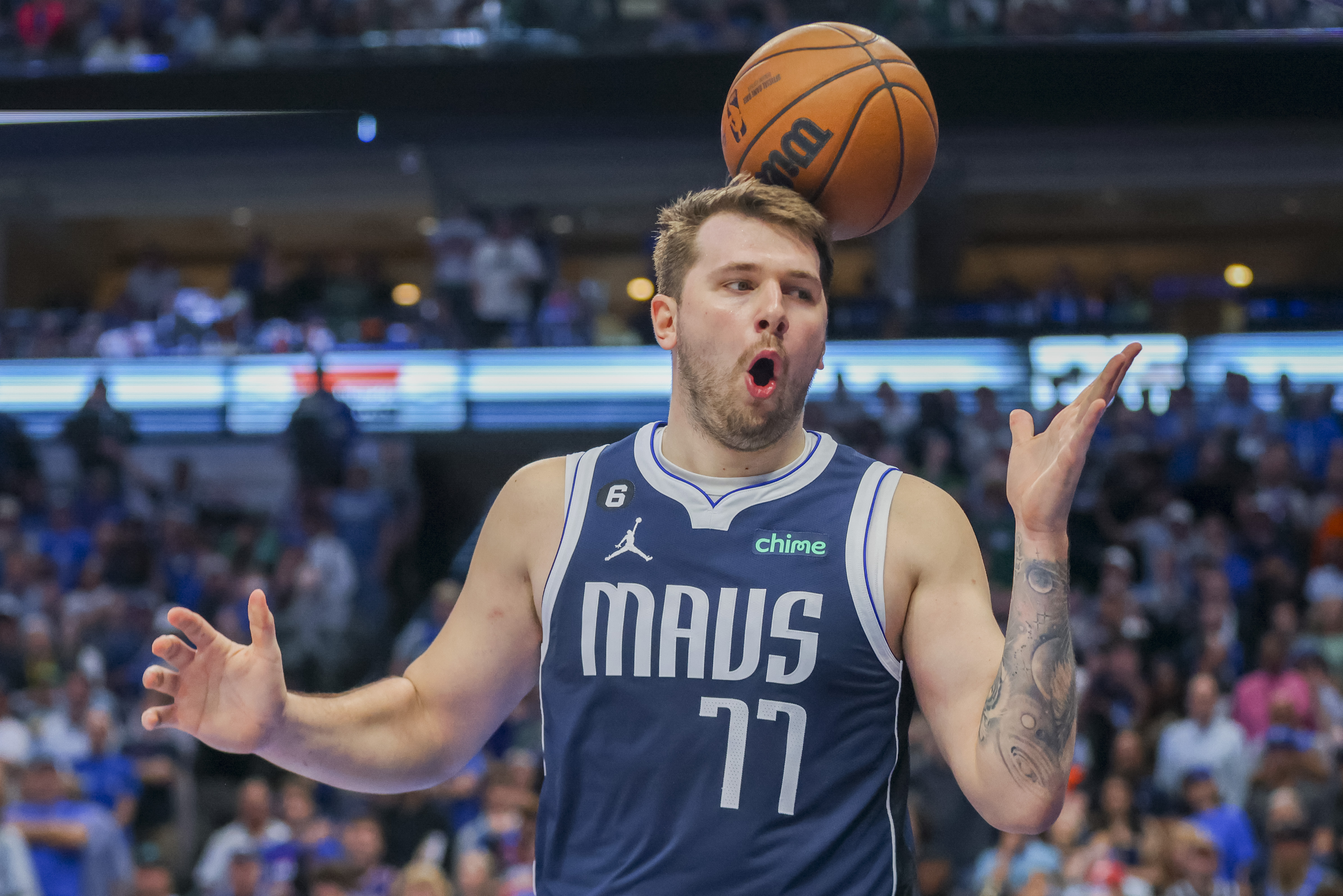 Photos: Mavs' Luka Doncic reacts to a foul call against the Suns