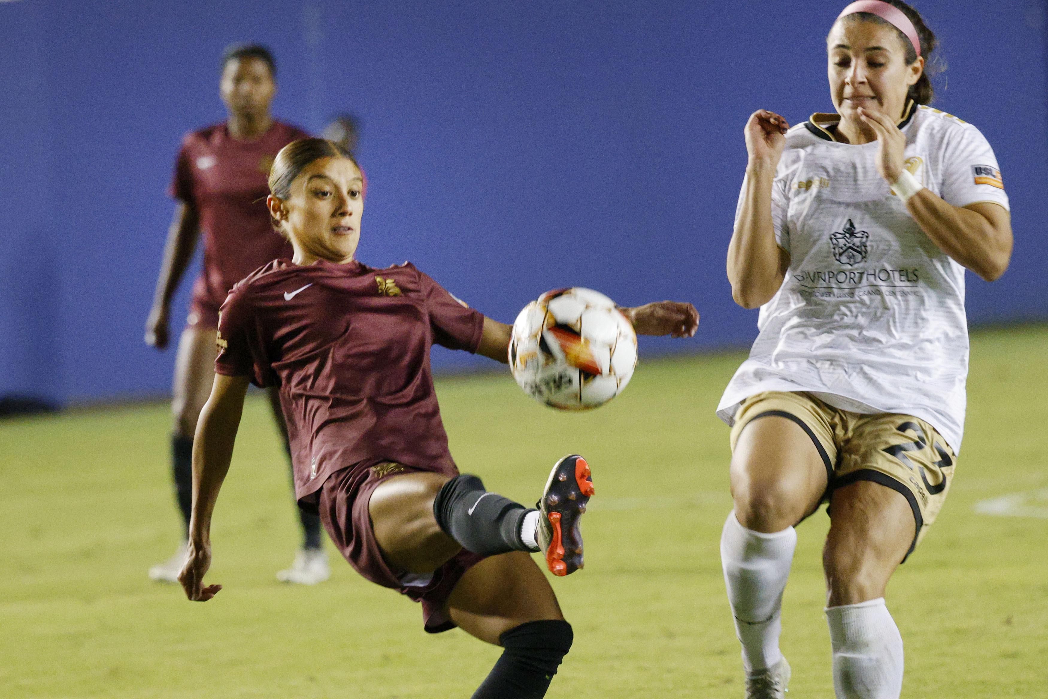 Dallas Trinity forward Natalie Wagner (25) kicks the ball against Spokane Zephyr midfielder ...