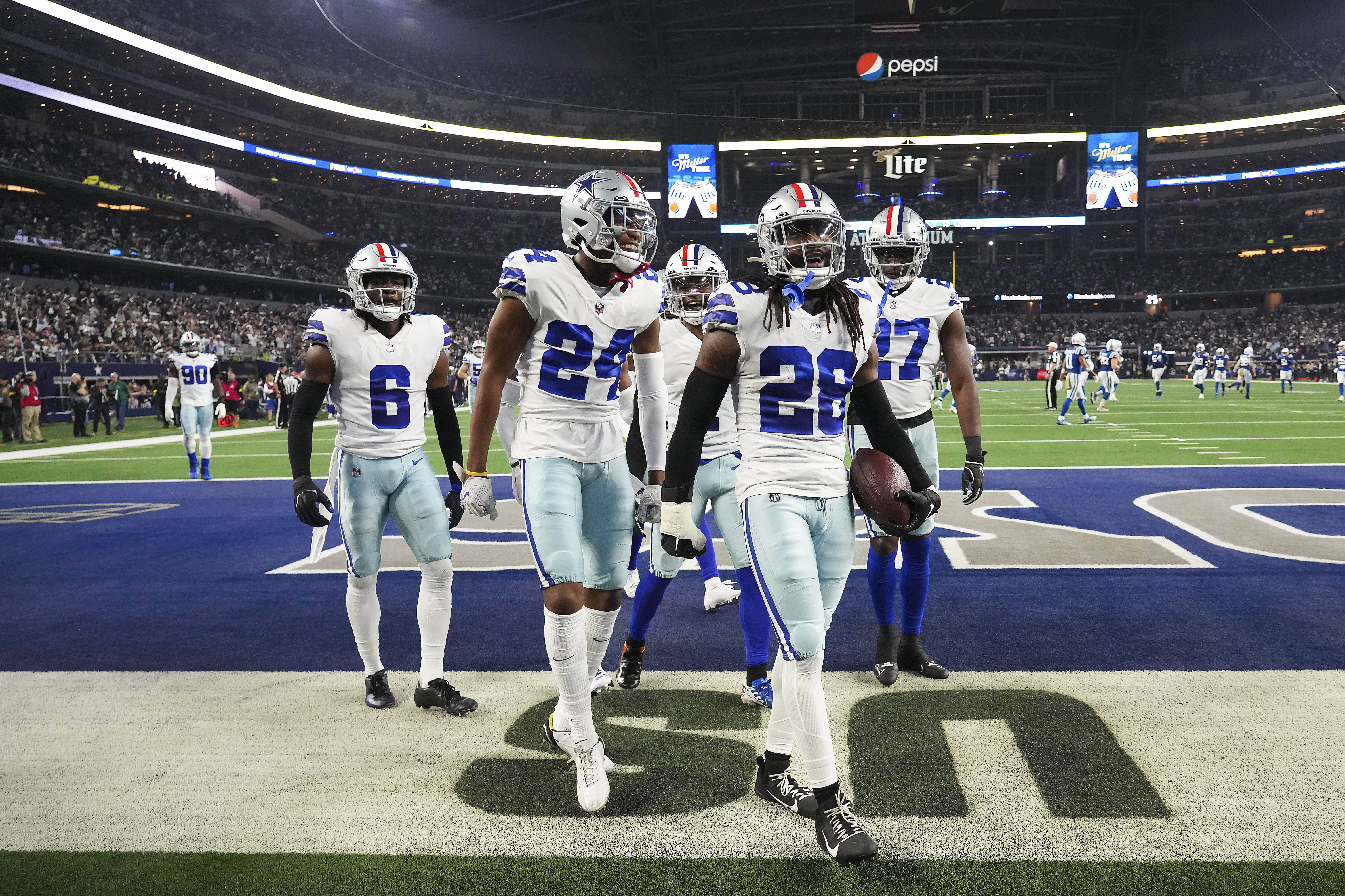 CeeDee Lamb of the Dallas Cowboys scores a touchdown as Isaiah