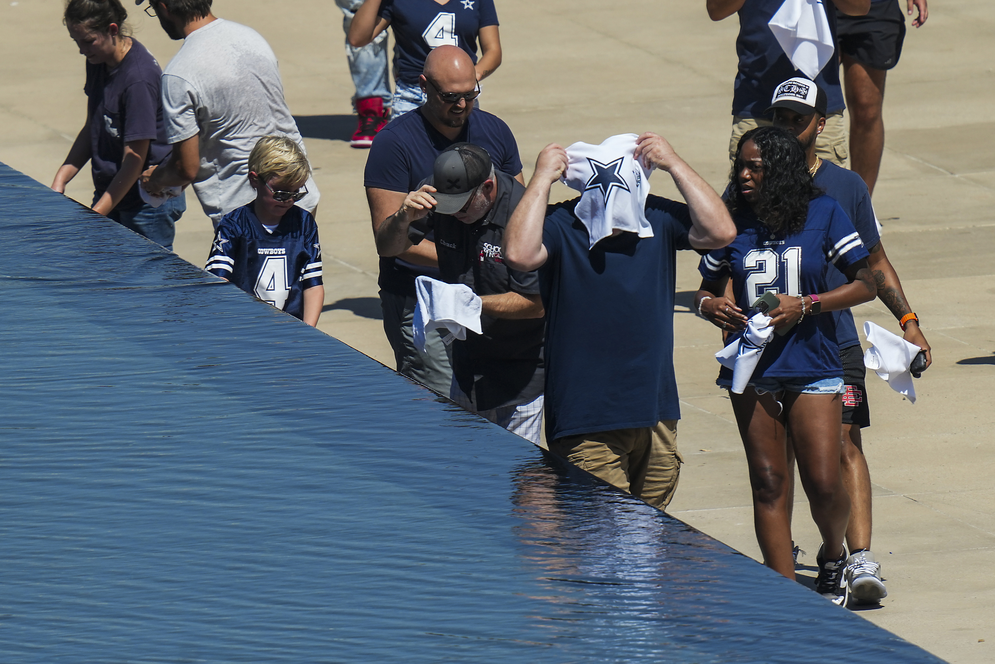 Dallas Cowboys running back Deuce Vaughn (42) and wide receiver John  Stephens Jr. (49) run out on to the field before an NFL pre-season football  game against the Seattle Seahawks, Saturday, Aug.