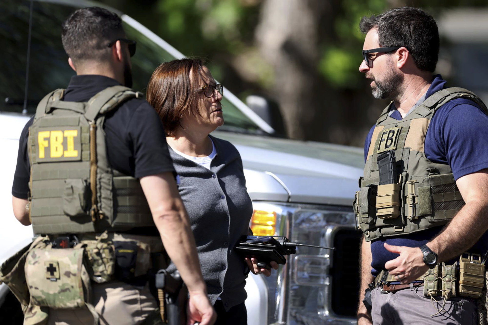 Members of FBI talk with each other at the scene of a shooting on Galway Drive in Charlotte,...