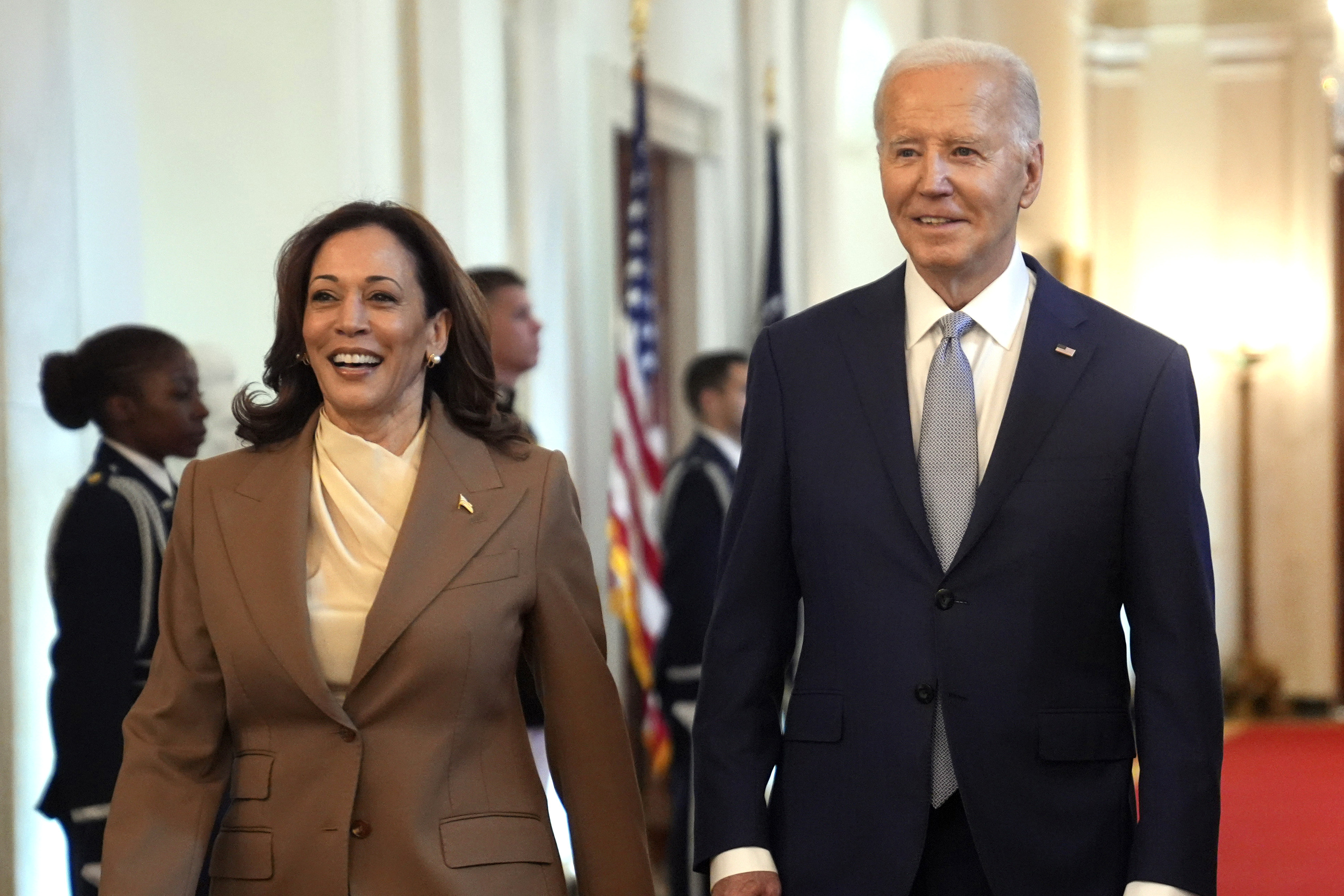 FILE - Vice President Kamala Harris, left, and President Joe Biden arrive for an event in...