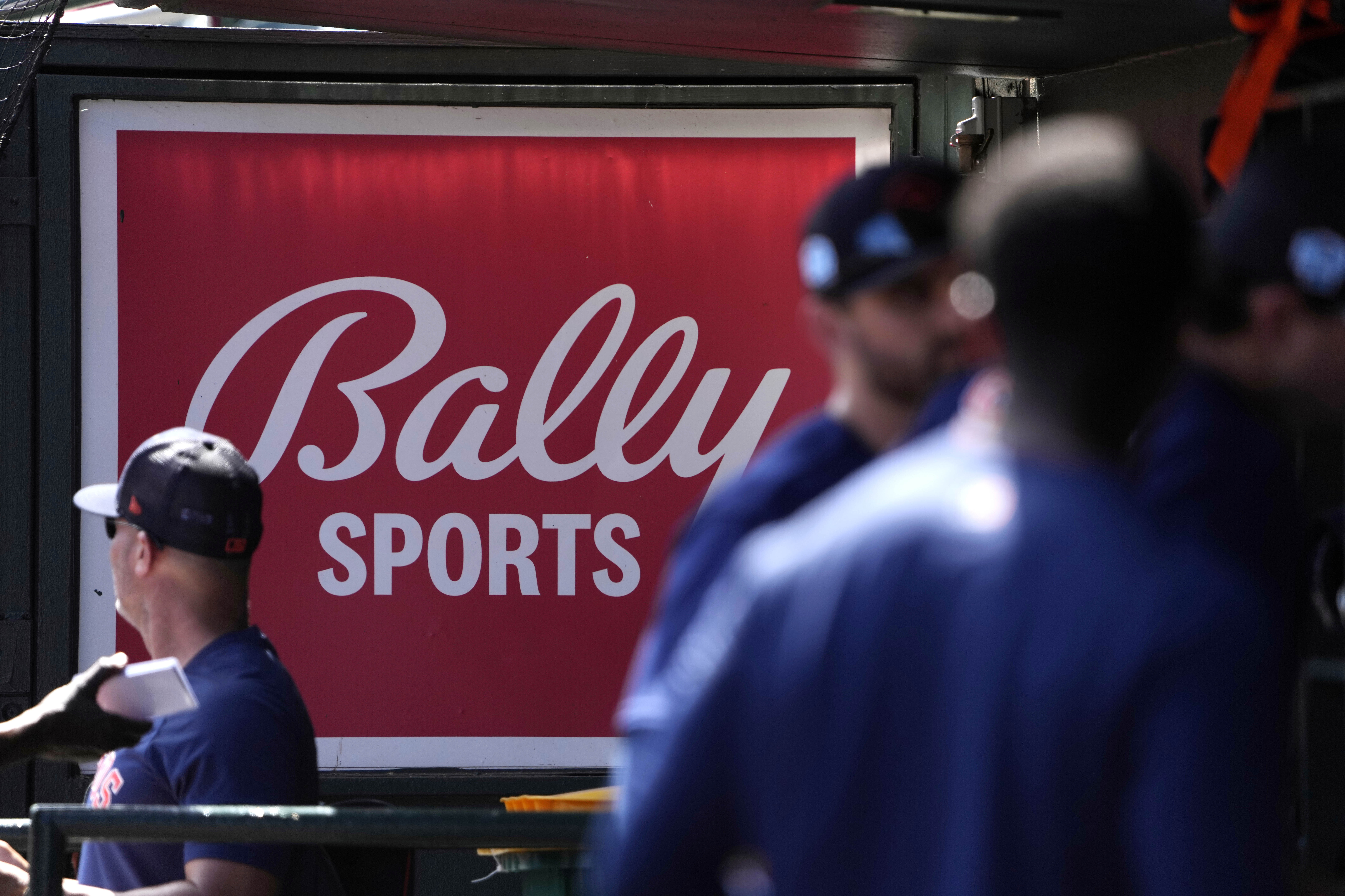 A Bally Sports sign hung in a dugout before the start of a March 2023 spring training...