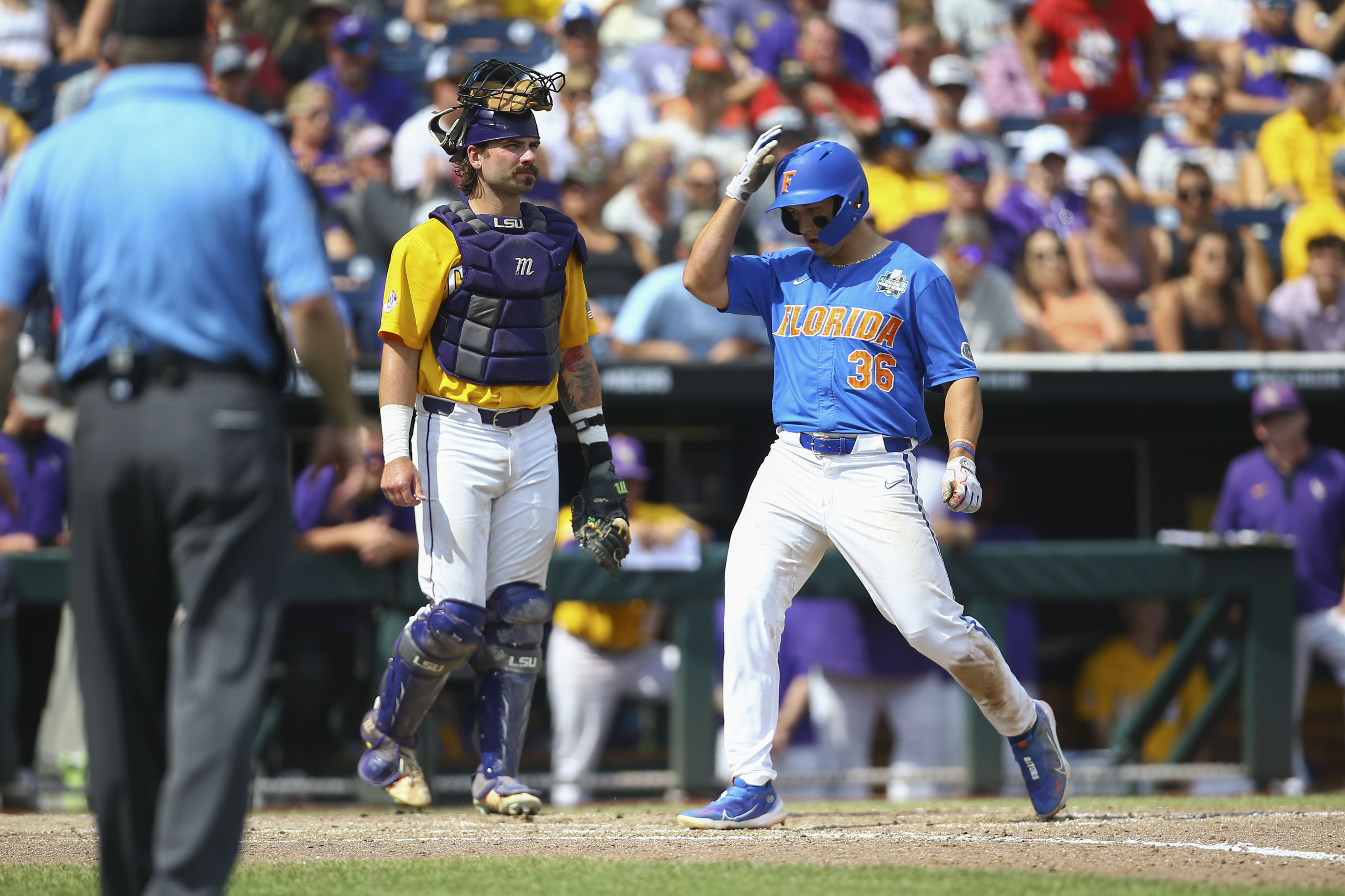 Wyatt Langford of the Florida Gators rounds the bases after