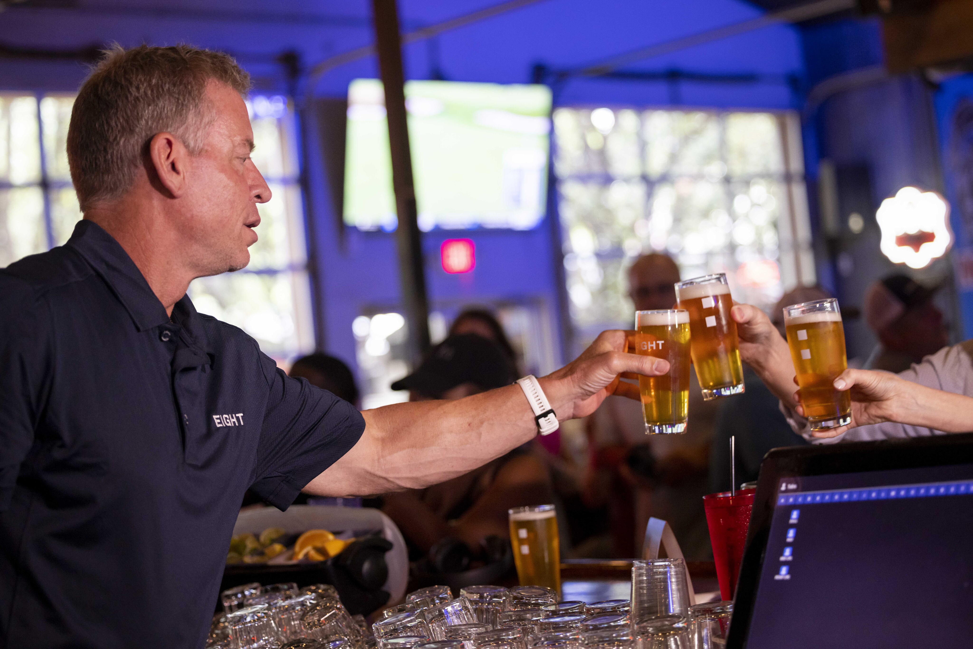 Photos of Troy Aikman at Union Draft House promoting beer