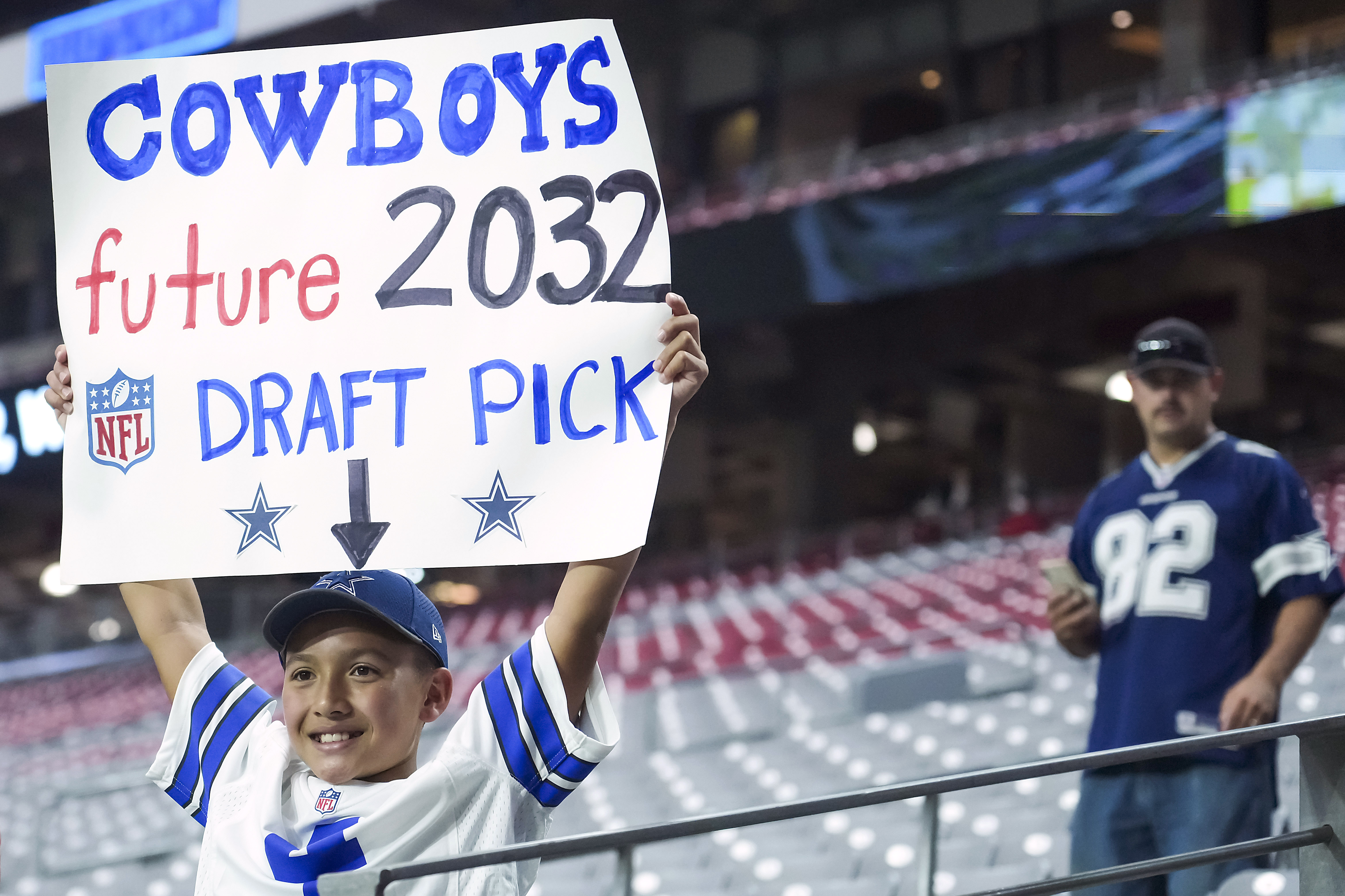 Fans cheer during the first half of a preseason NFL football game between  the Dallas Cowboys and the Houston Texans in Arlington, Texas, Saturday,  Aug. 21, 2021. (AP Photo/Michael Ainsworth Stock Photo 