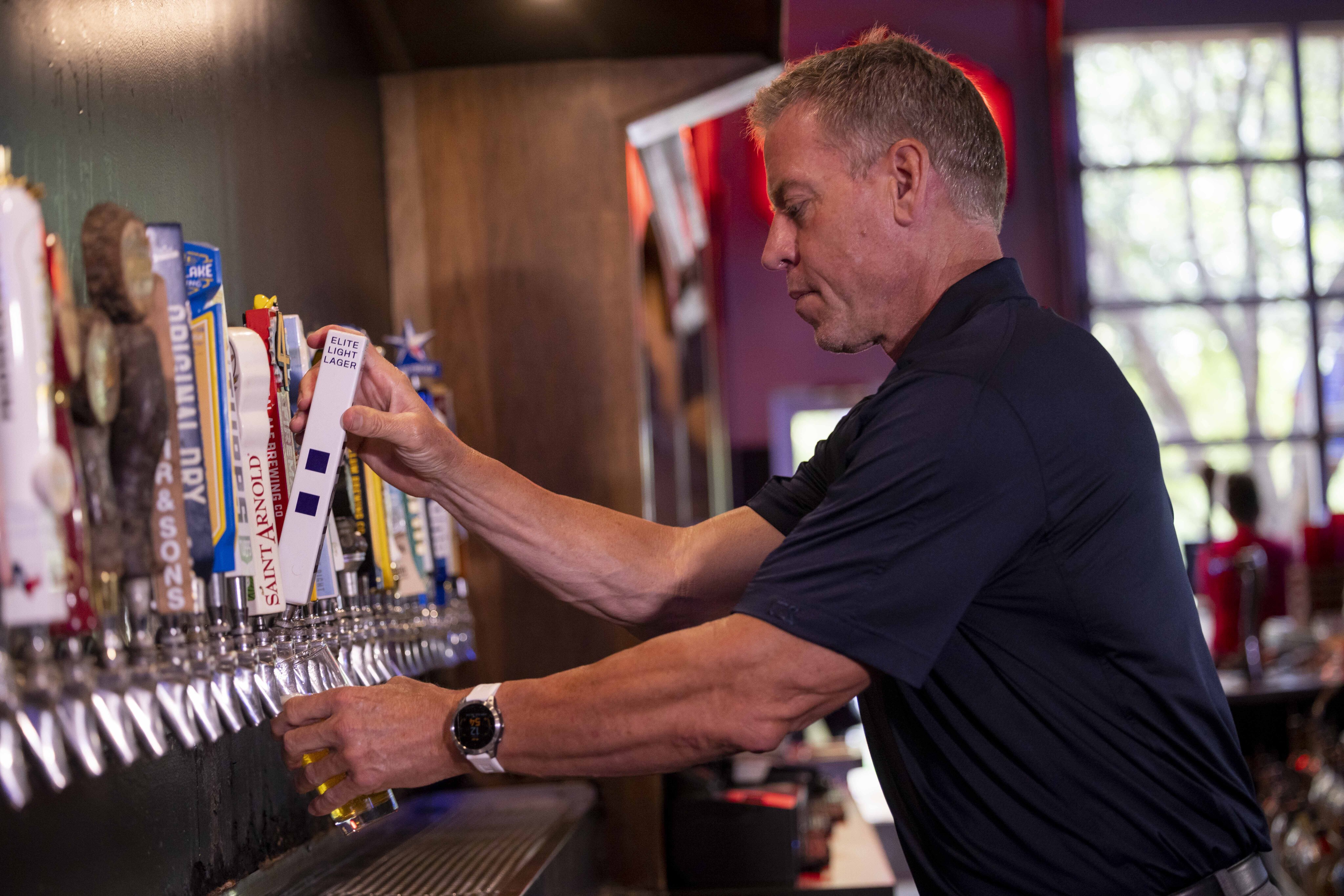 Photos of Troy Aikman at Union Draft House promoting beer