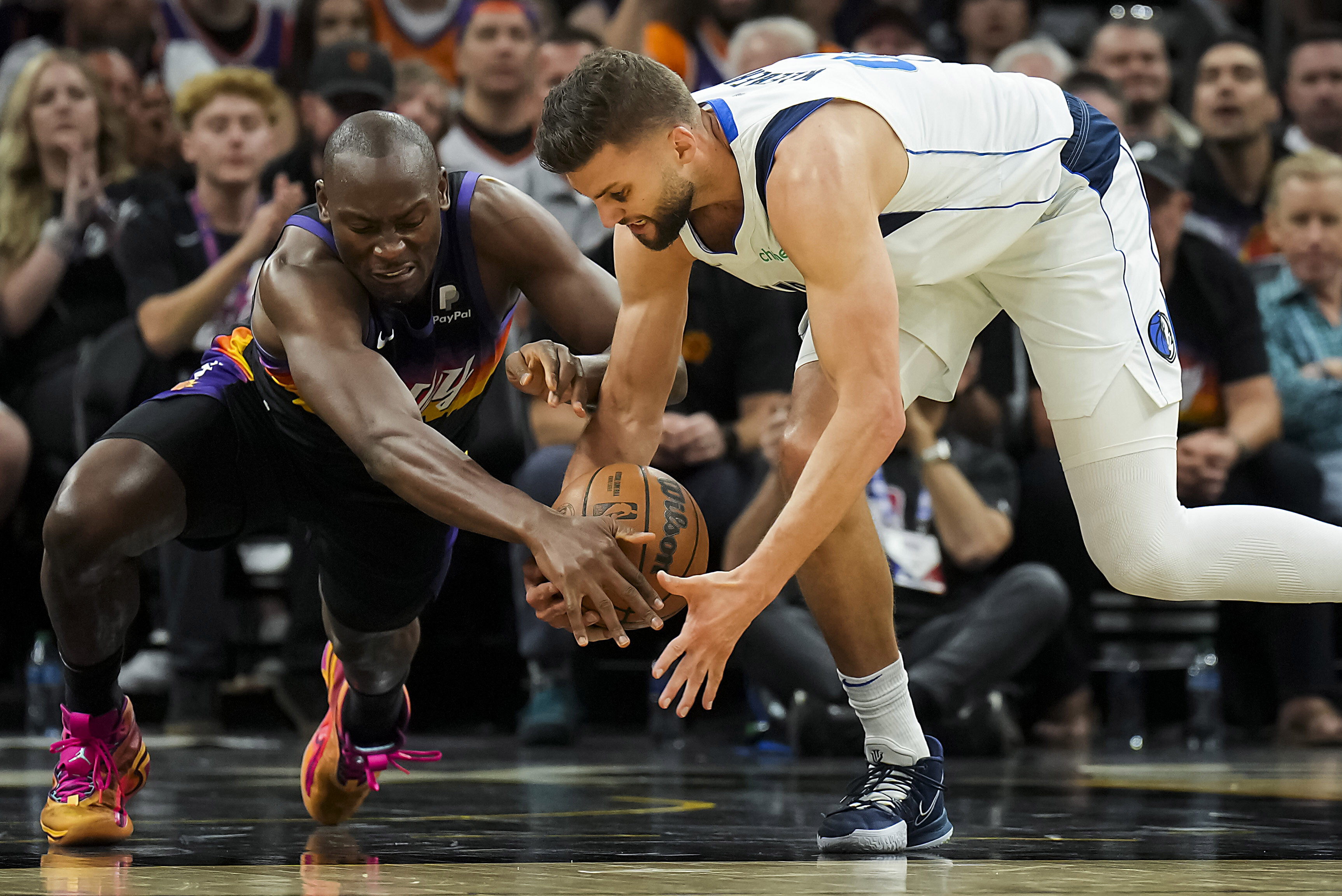 Mavericks' Marquese Chriss confronts Suns' Bismack Biyombo in