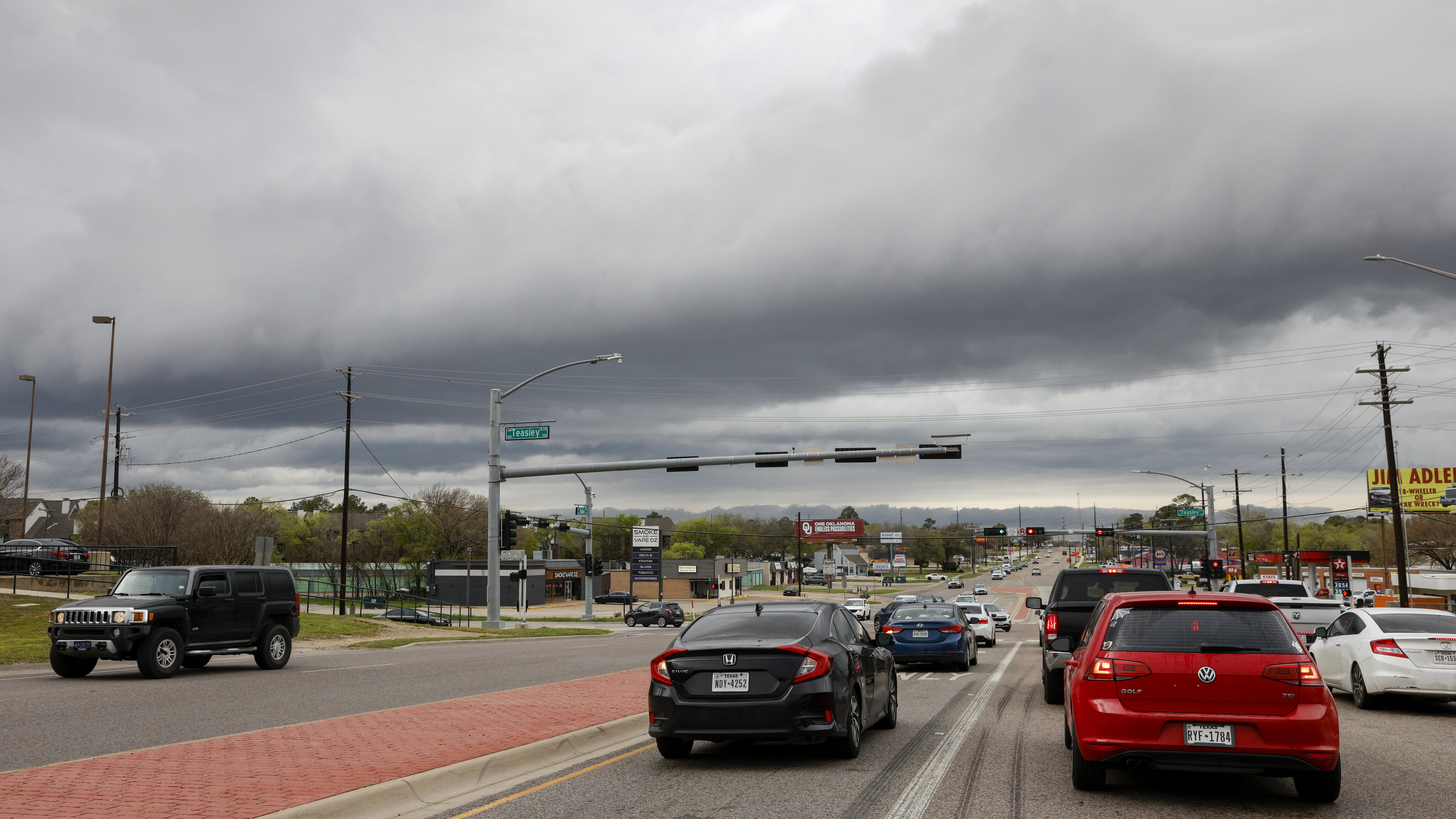 Storm clouds linger over Teasley Lane and Dallas Drive on Thursday, March 16, 2023 in...