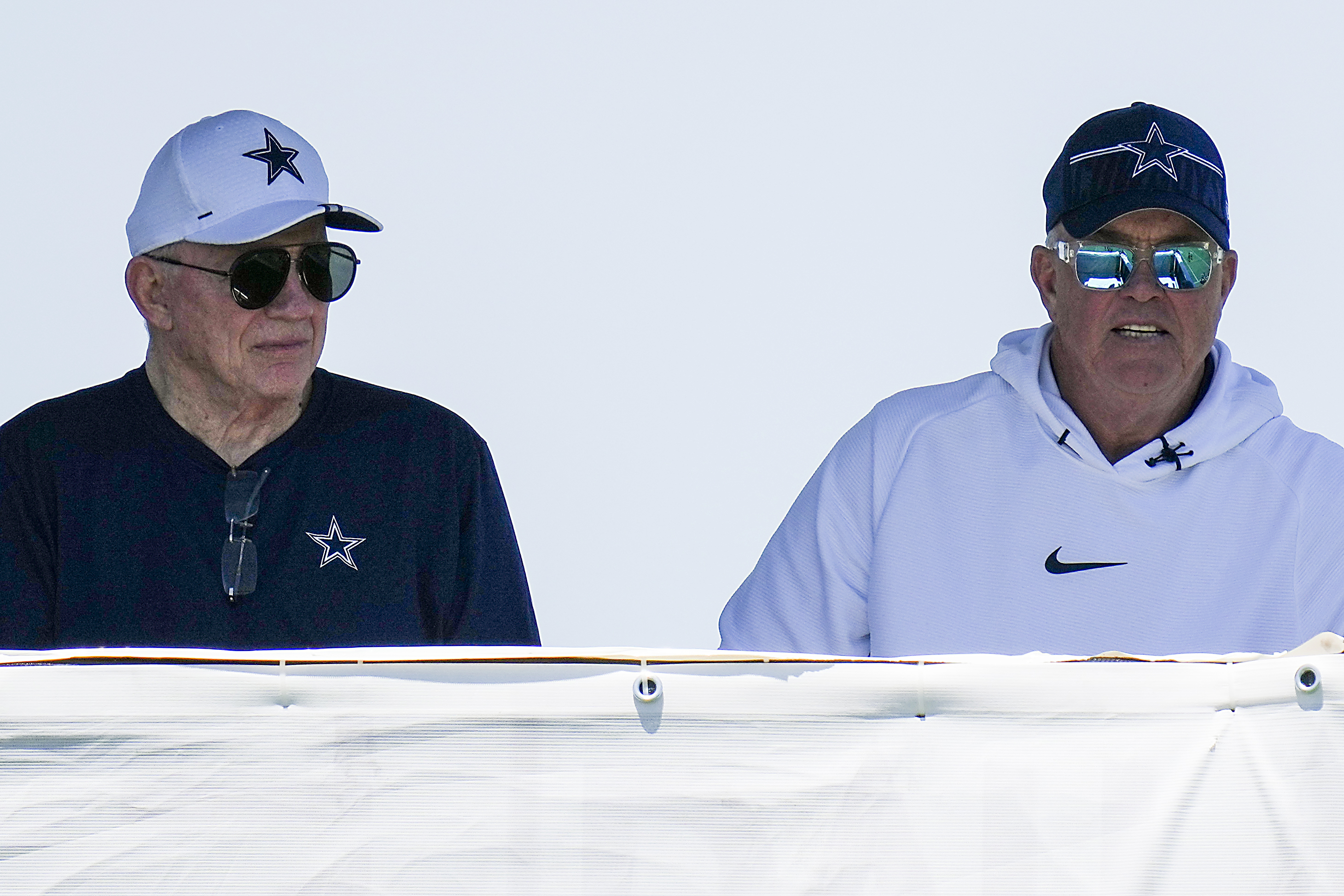 Dallas Cowboys Executive Vice President Jerry Jones Jr., left, and Chief  Operating Officer Stephen Jones, right, on the field before the start of an  NFL football game against the Washington Redskins, Sunday