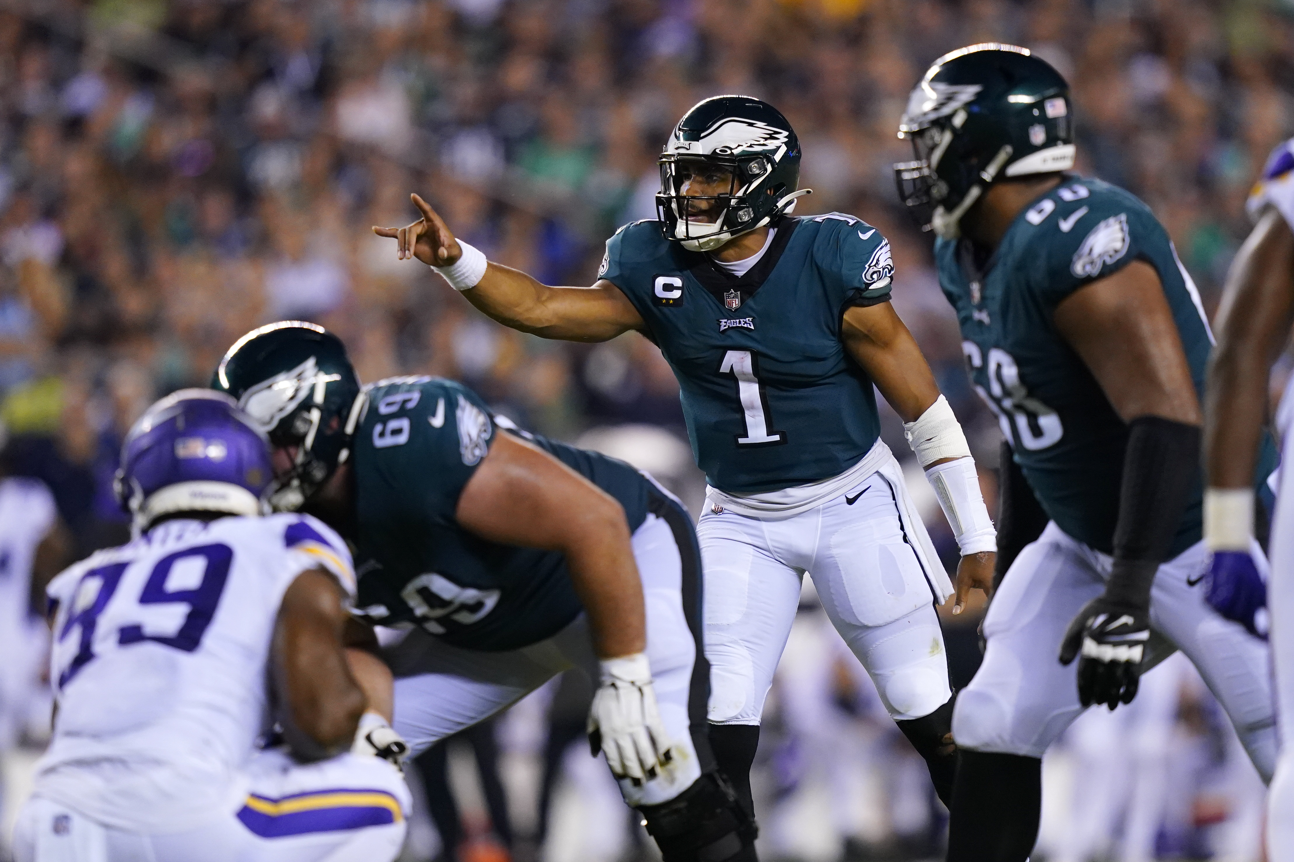 A Dallas Cowboys fan and a Philadelphia Eagles fan pose for a photo before  an NFL football game between the Eagles and Cowboys on Sunday, Oct. 16,  2022, in Philadelphia. (AP Photo/Matt