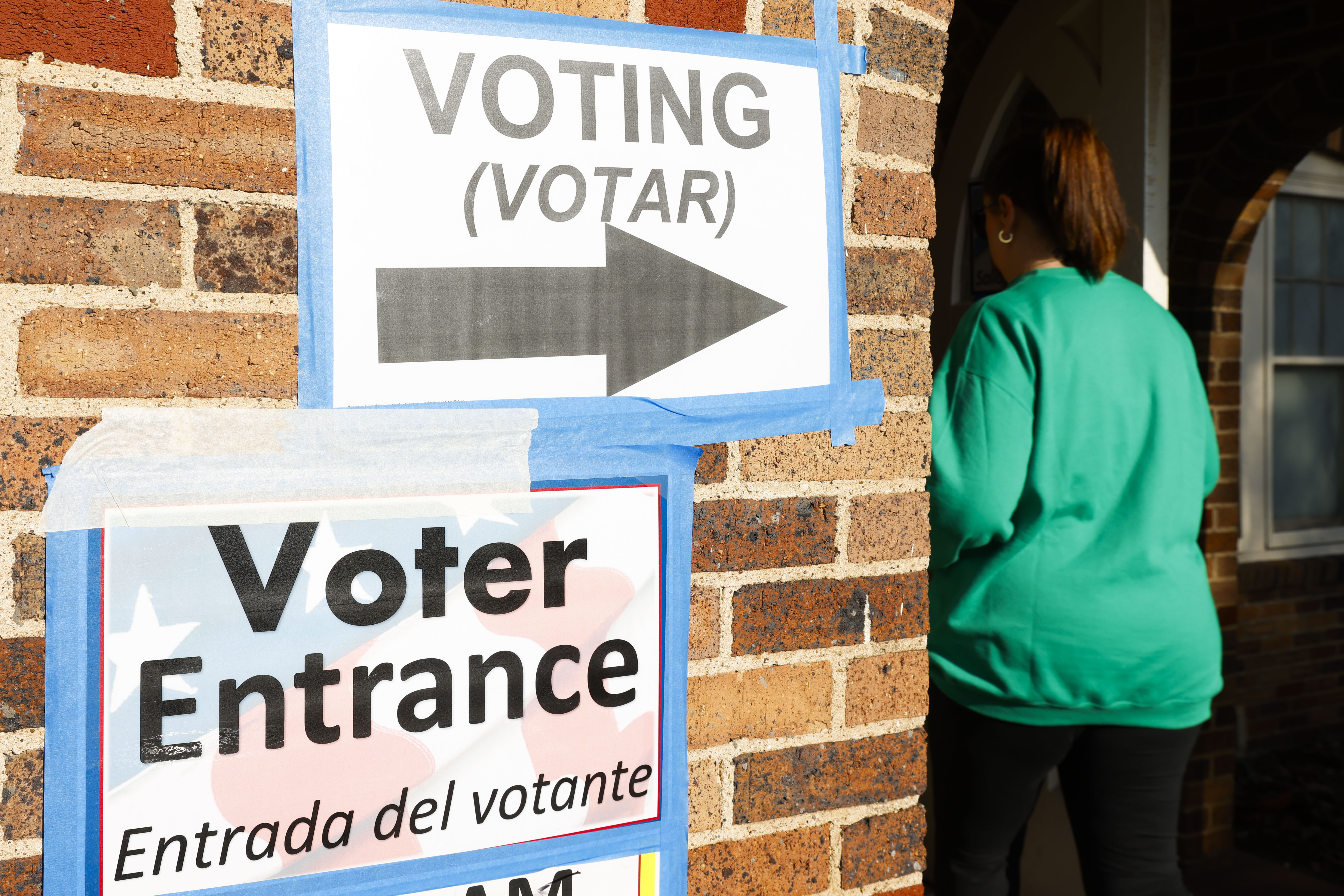 Voters enter the Ellis County Woman's Building during the state's primary election, Tuesday,...