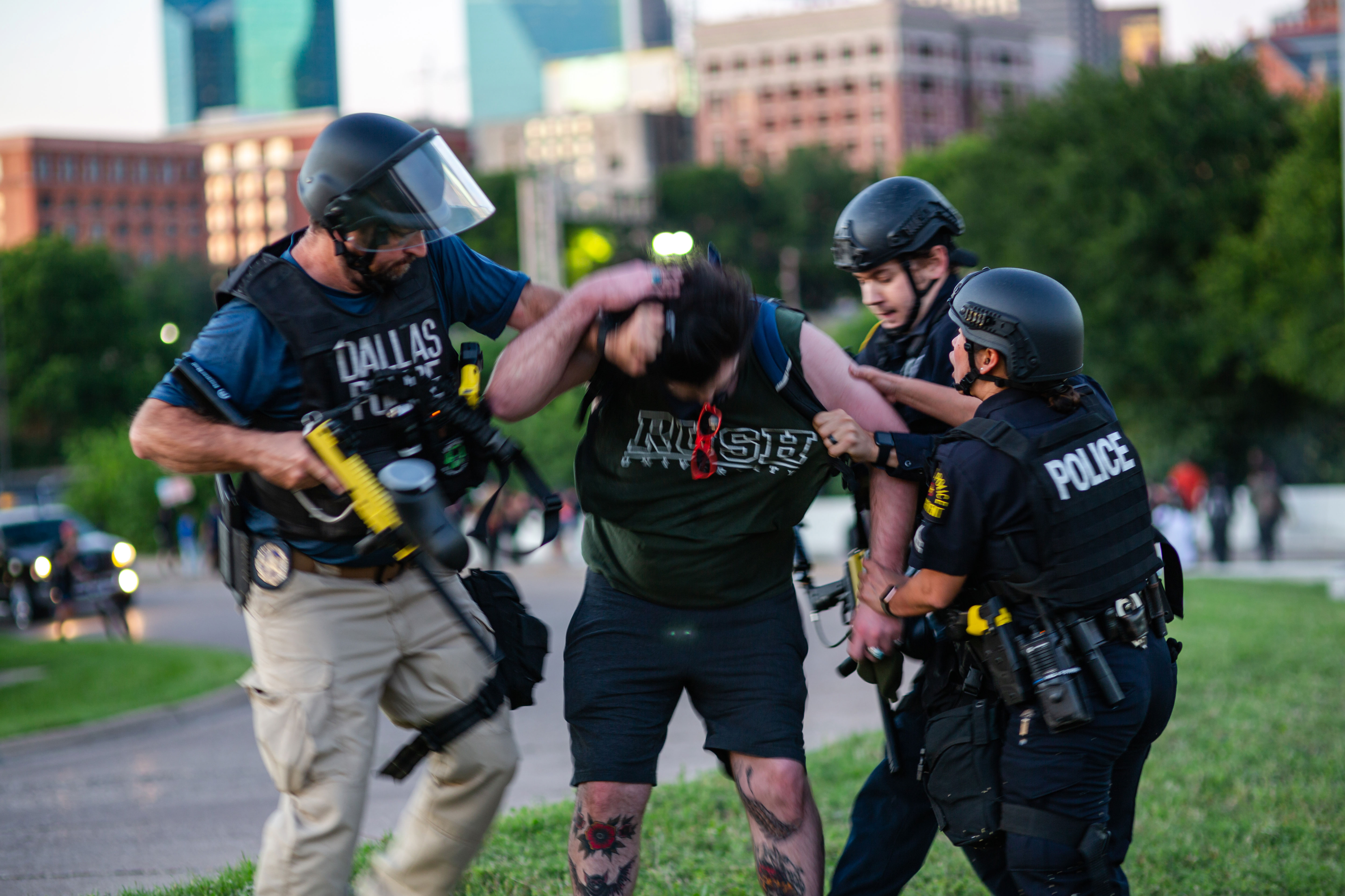 I Felt Like My Chest Was On Fire Photo Shows Dallas Police Officer Shooting Protester With Pepper Ball Gun - police yelling to put hands on your head roblox id