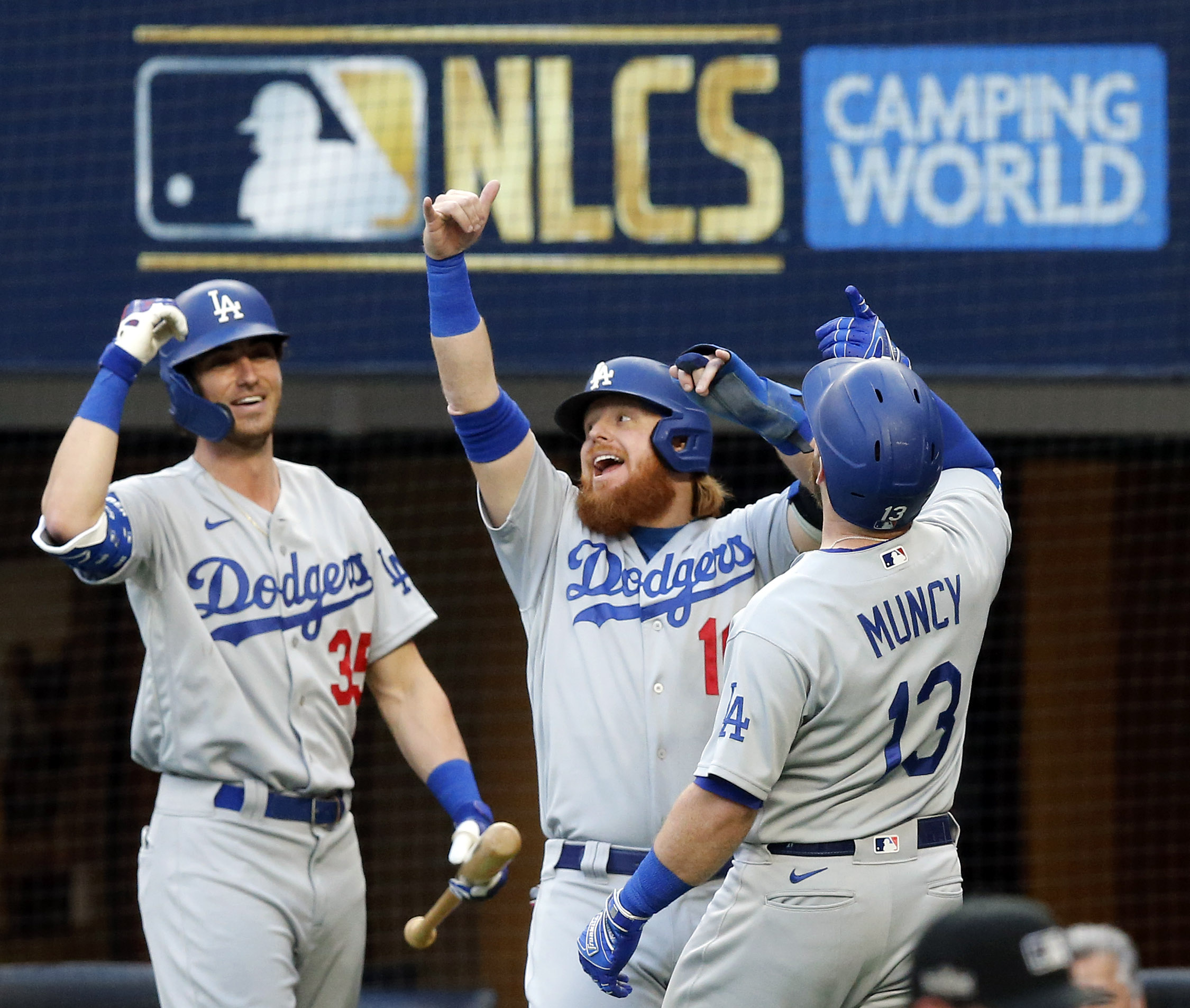 Los Angeles Dodgers second baseman Max Muncy (13) is congratulated