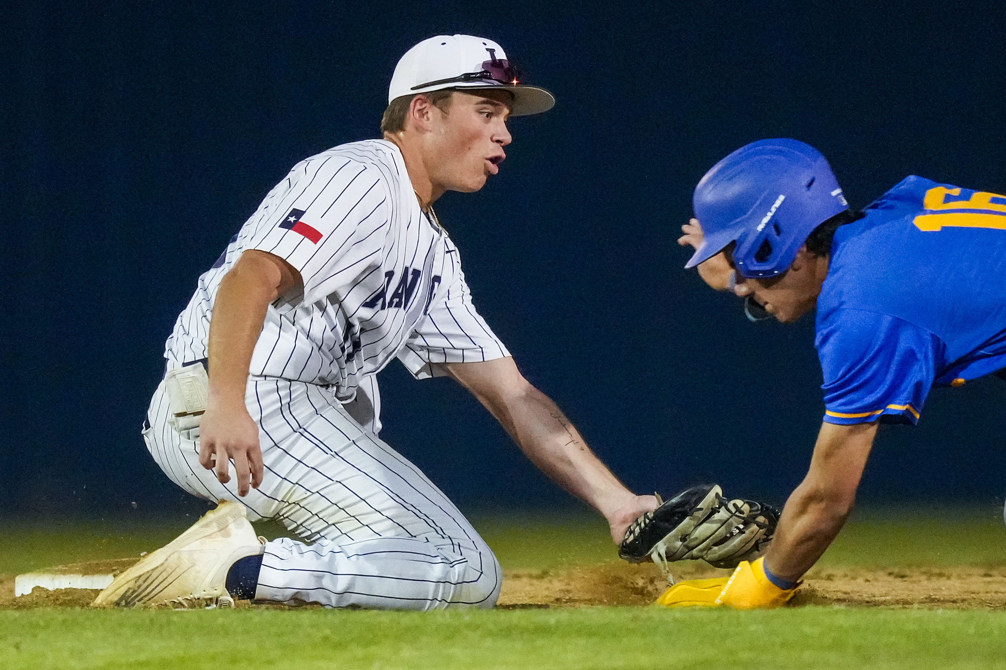 Frisco Lone Star shortstop James Dagenhart applies the tag as Frisco’s Jayson Bustamante is...