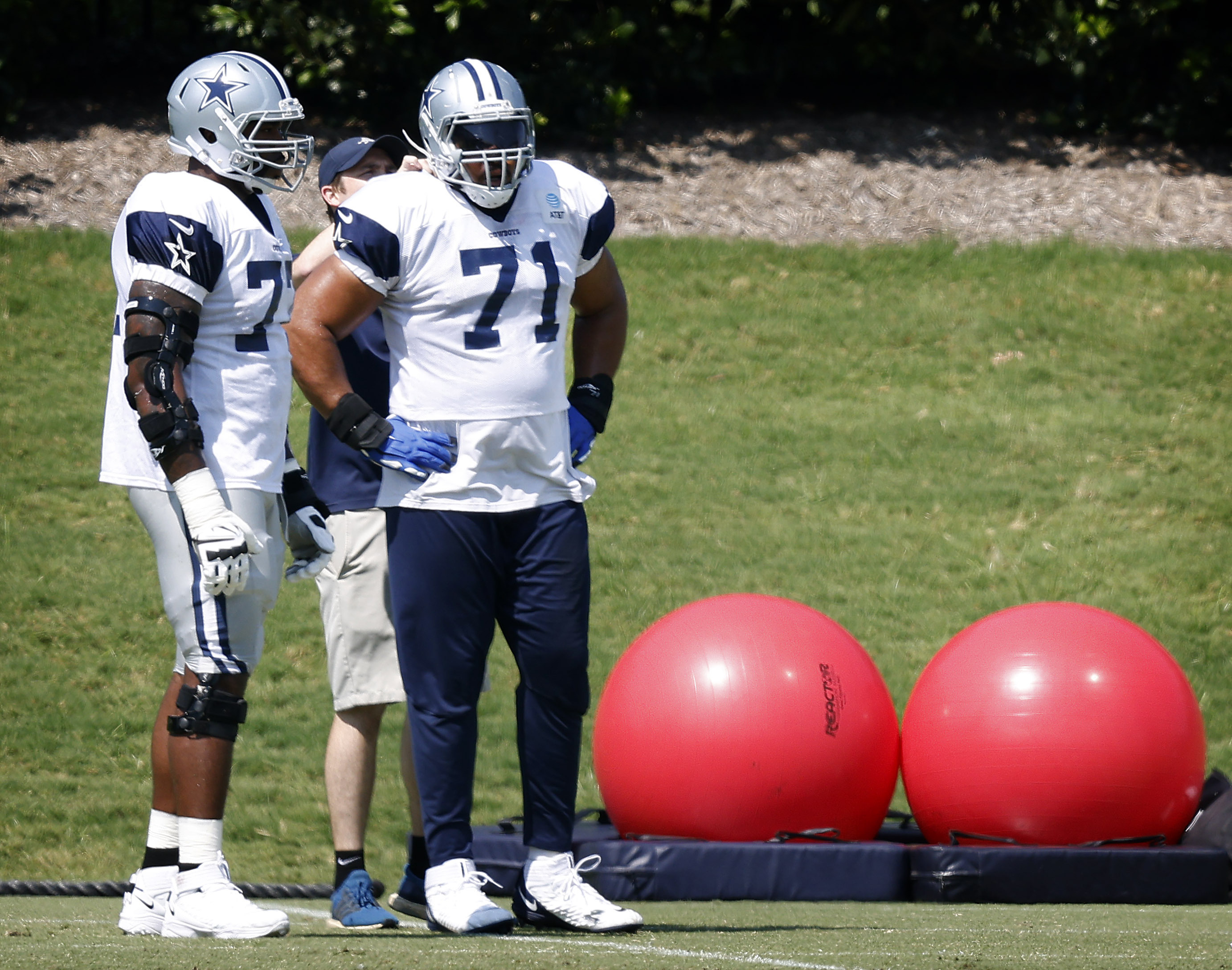 Dallas Cowboys lineman Aviante Collins warms up prior to the game