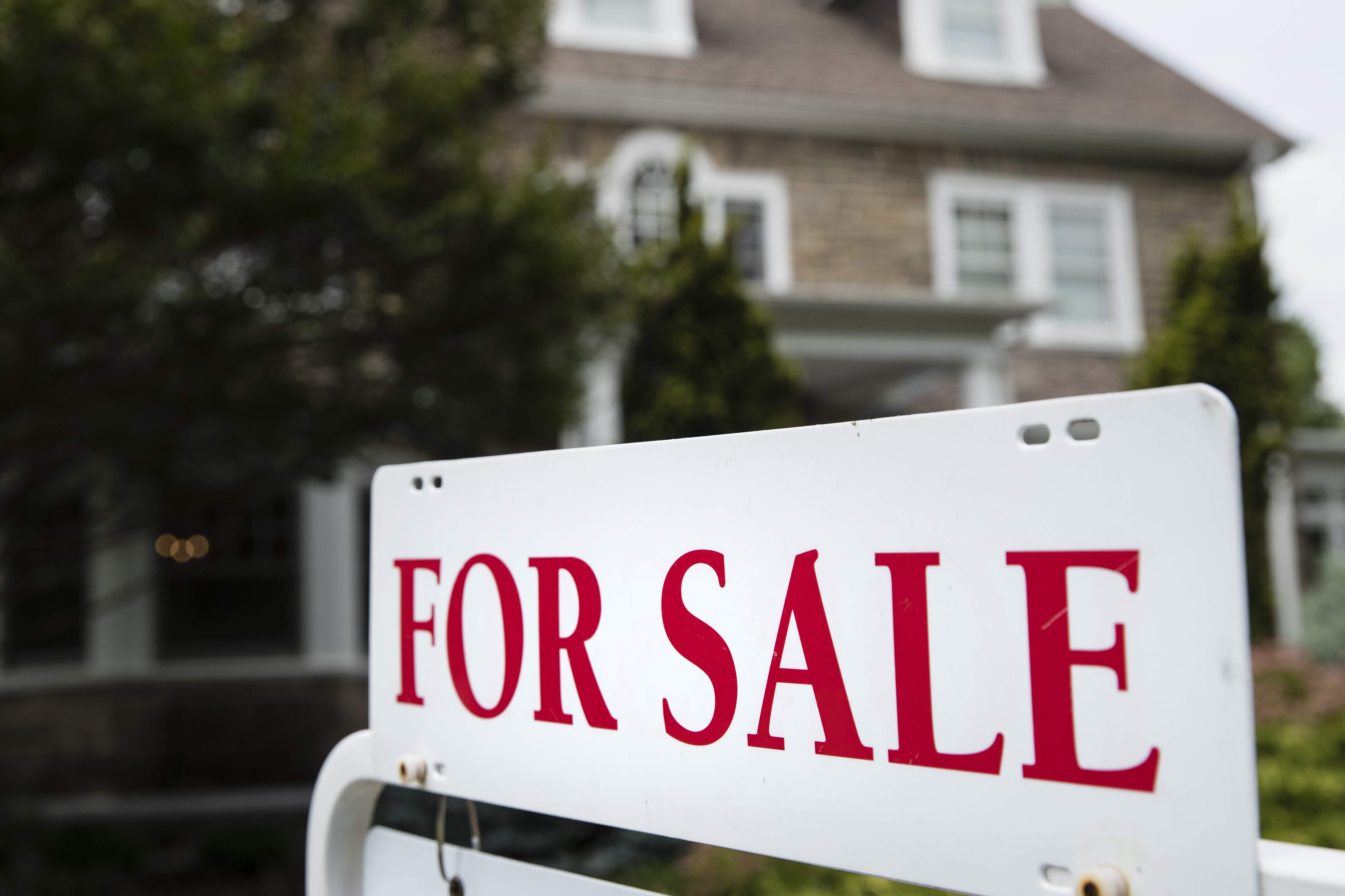 FILE - A "for sale" sign stands in front of a house in Pennsylvania, near Philadelphia, on...