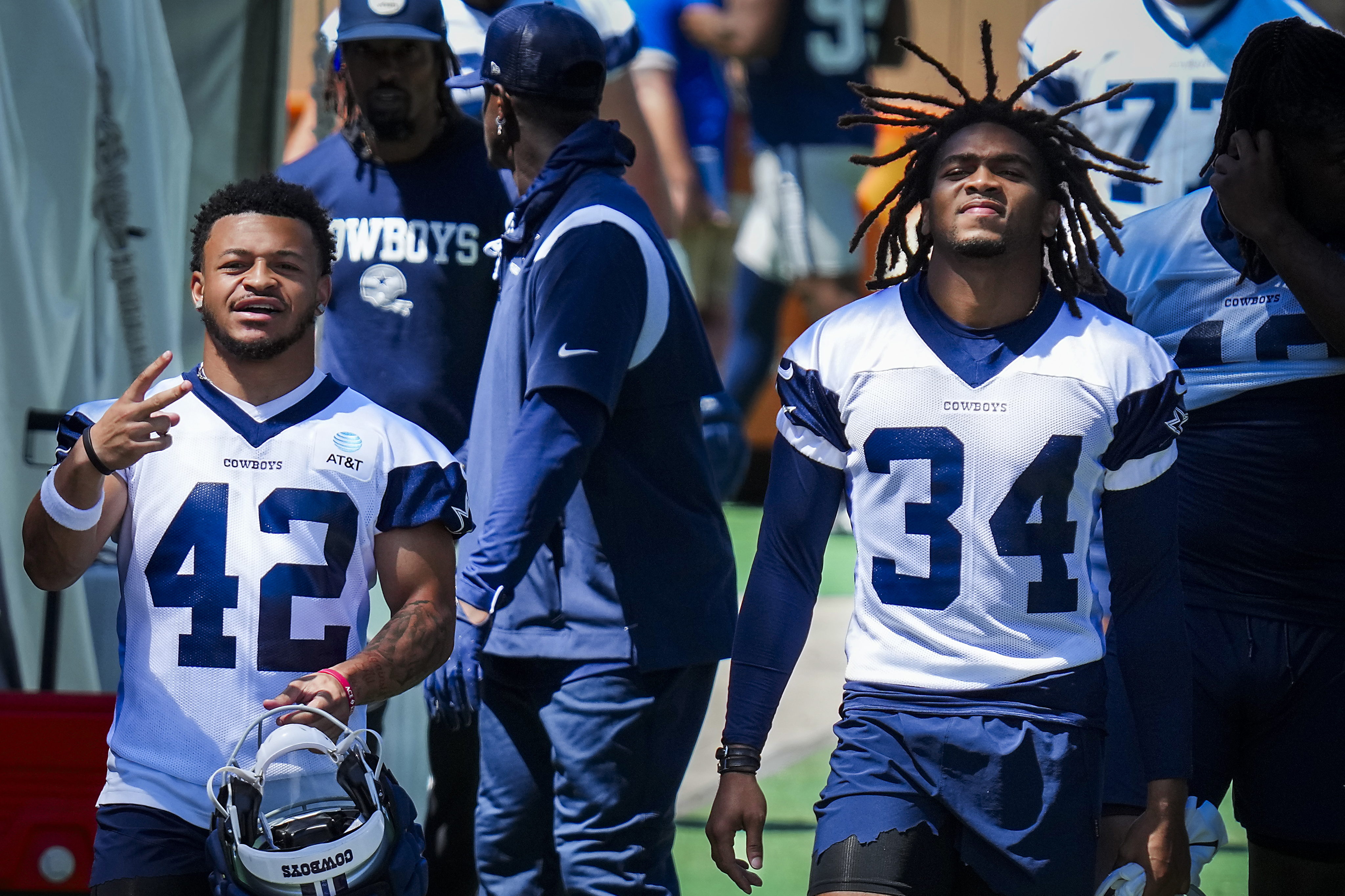 Dallas Cowboys cornerback Nahshon Wright, left, intercepts a pass by  quarterback Dak Prescott that was intended for wide receiver Jalen Tolbert  during the NFL football team's training camp Thursday, July 27, 2023