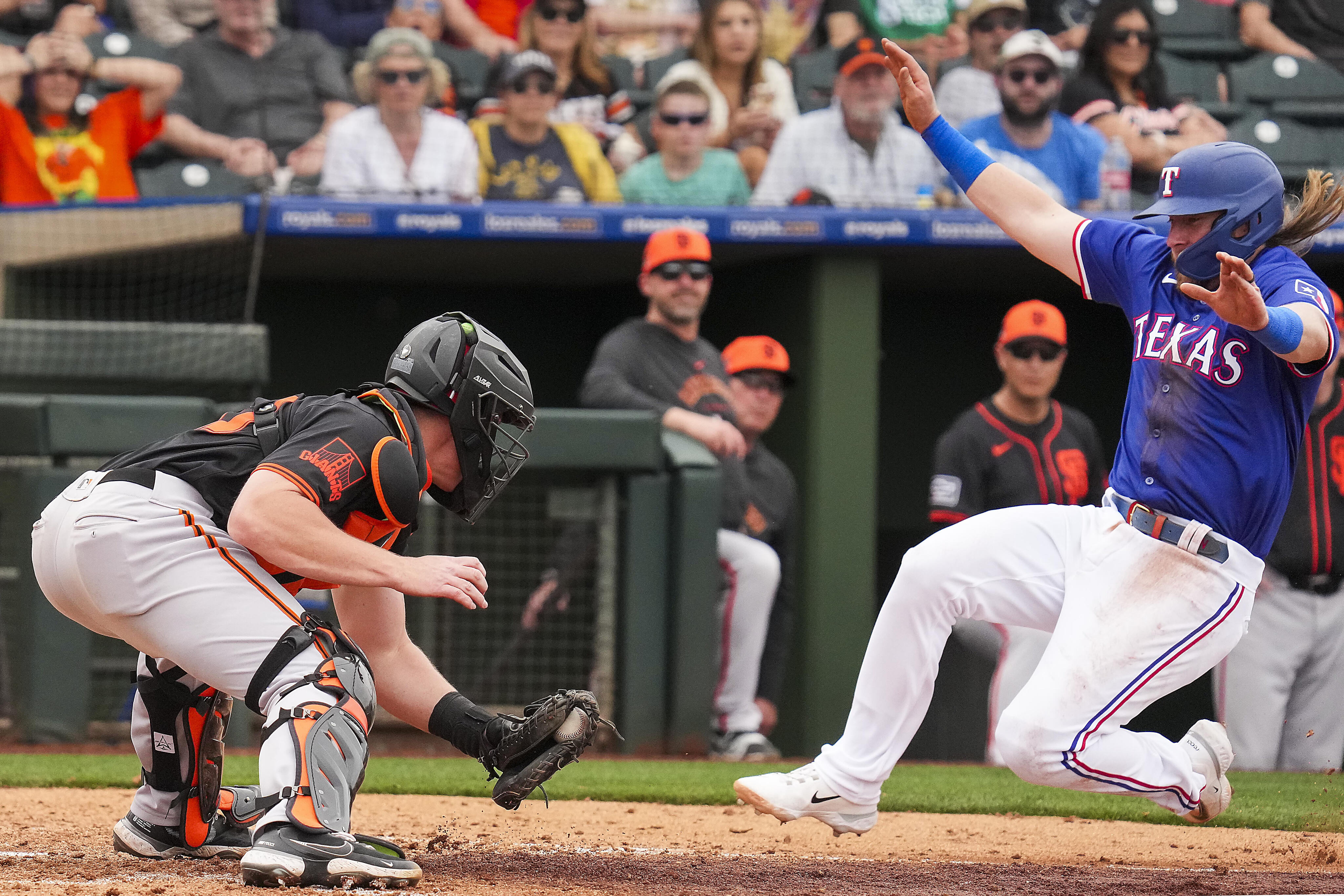 Rangers' Evan Carter exits spring training game after being hit by a pitch