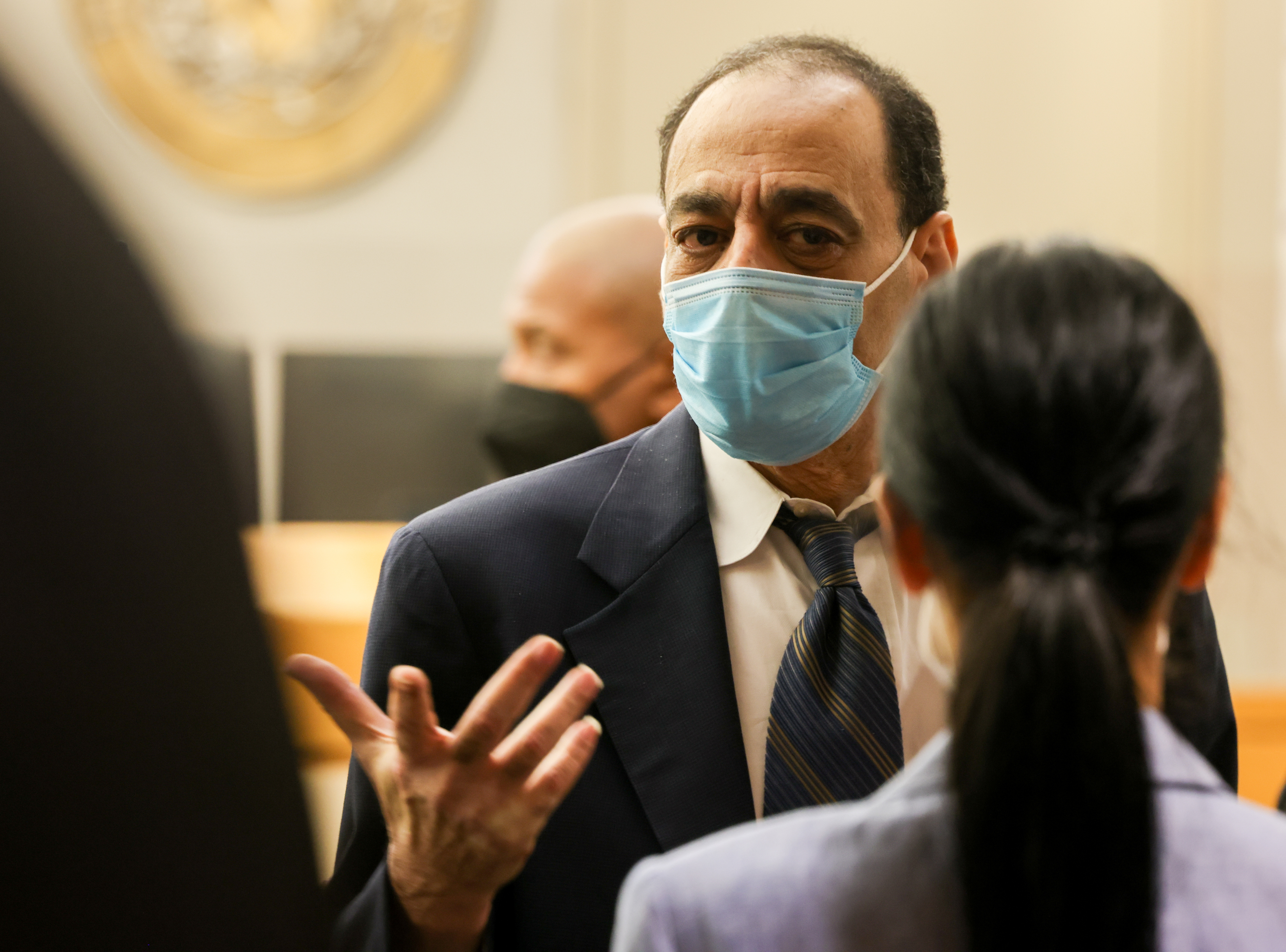 Yaser Said speaks to defense attorney Baharan Muse (right) after this trial at the Frank...