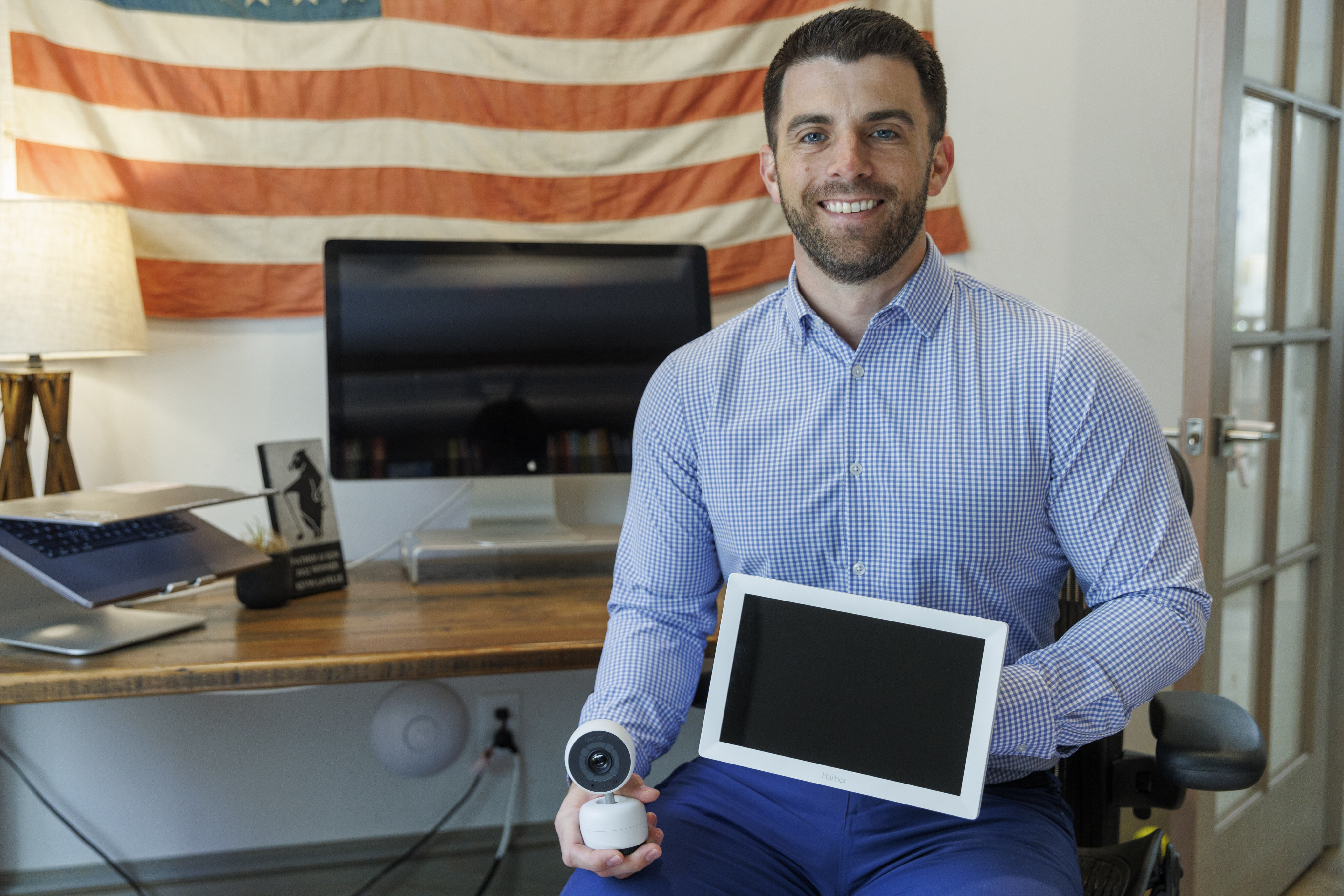 Harbor CEO and co-founder Kevin Lavelle sits in his home office with Harbor’s baby monitor...