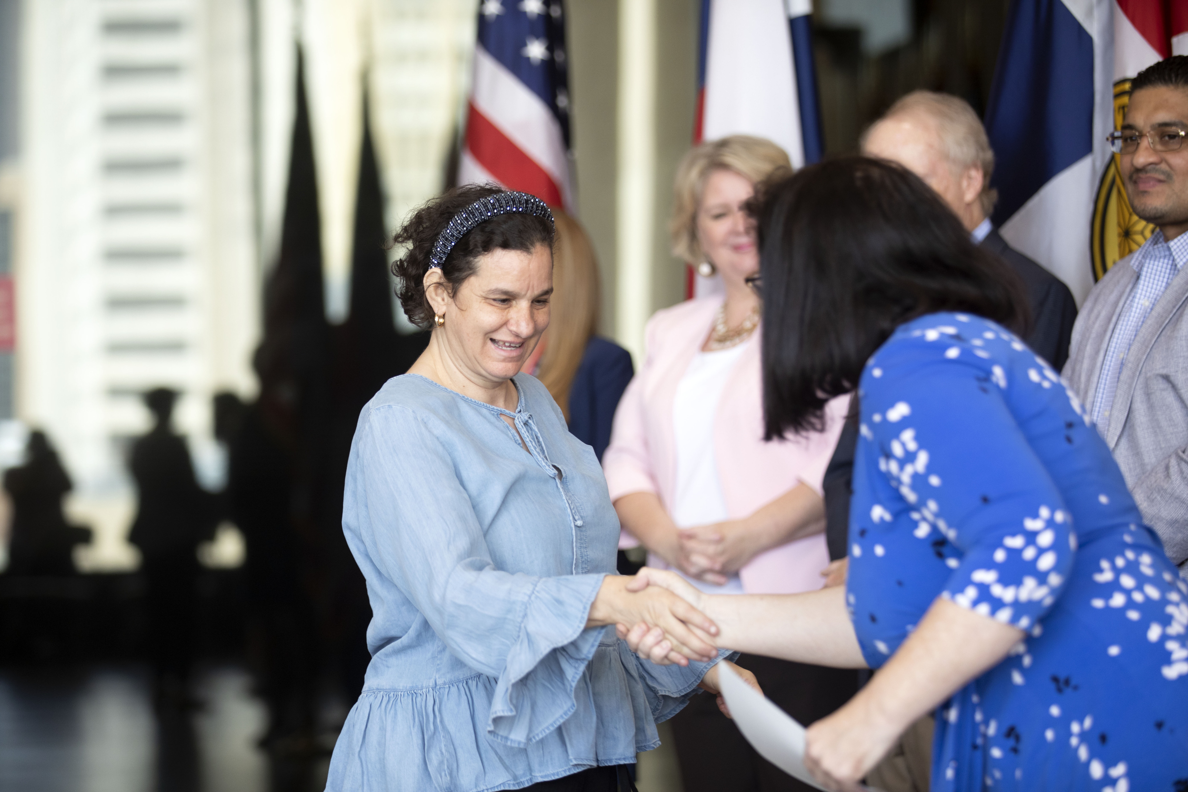 Syrian refugee Safe Sakkal, receives her citizenship at the first Naturalization ceremony in...