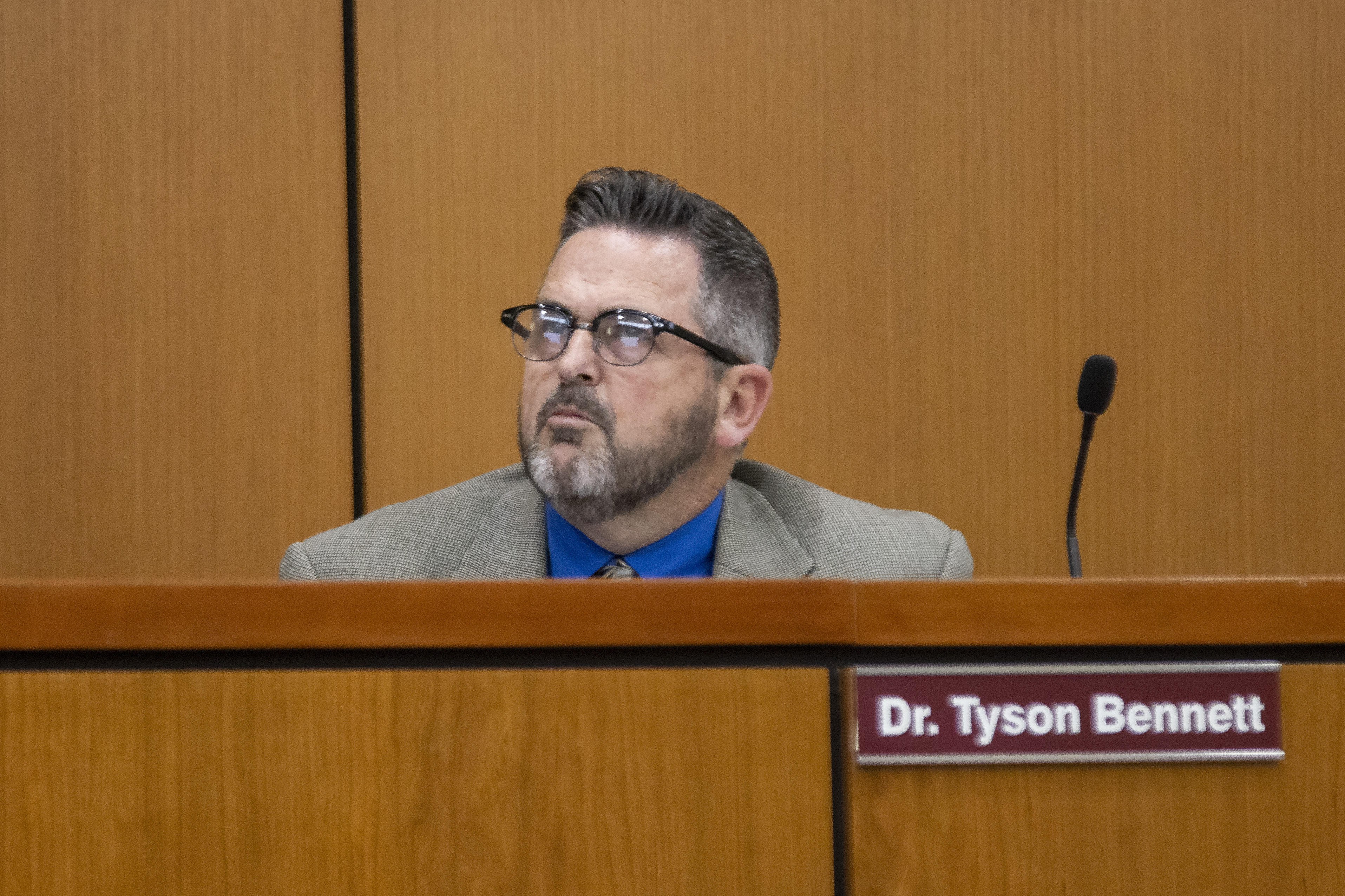  Superintendent Tyson Bennett sits as board members vote in support of opening a third-party...