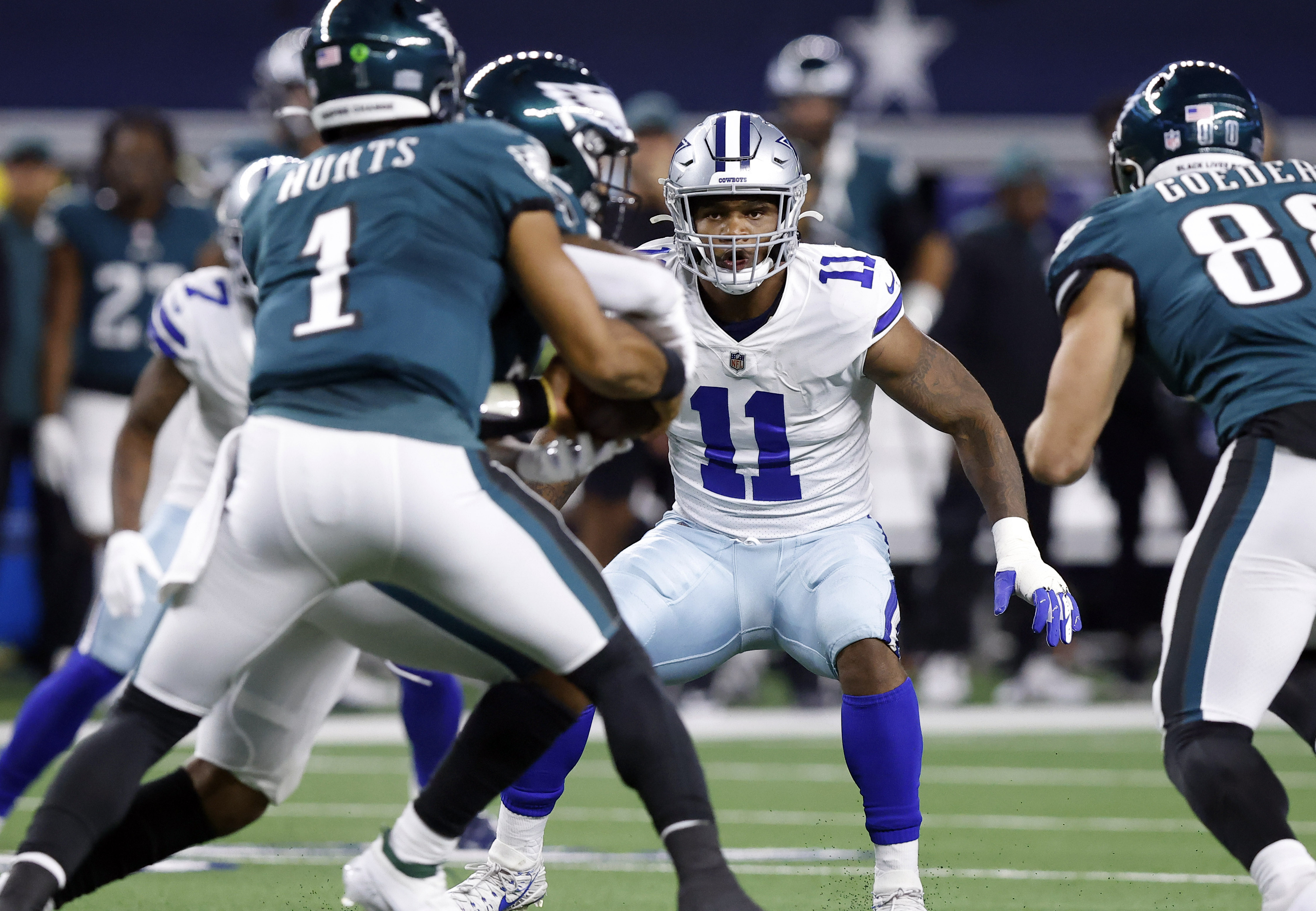 Dallas Cowboys' Micah Parsons (11) and Neville Gallimore leave the field  after an NFL football game