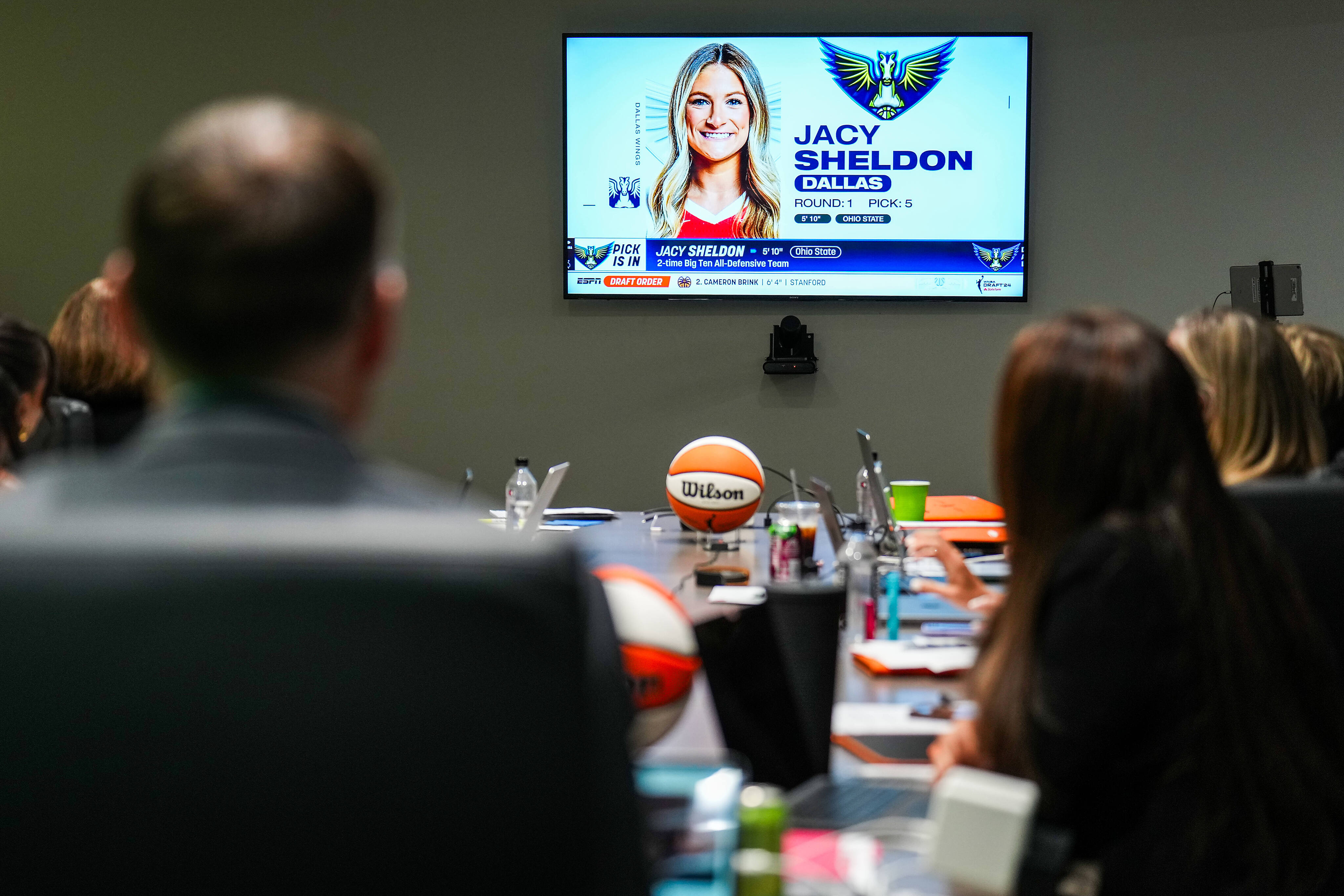 Dallas Wings President and CEO Greg Bibb watches coverage in the team’s draft war room after...