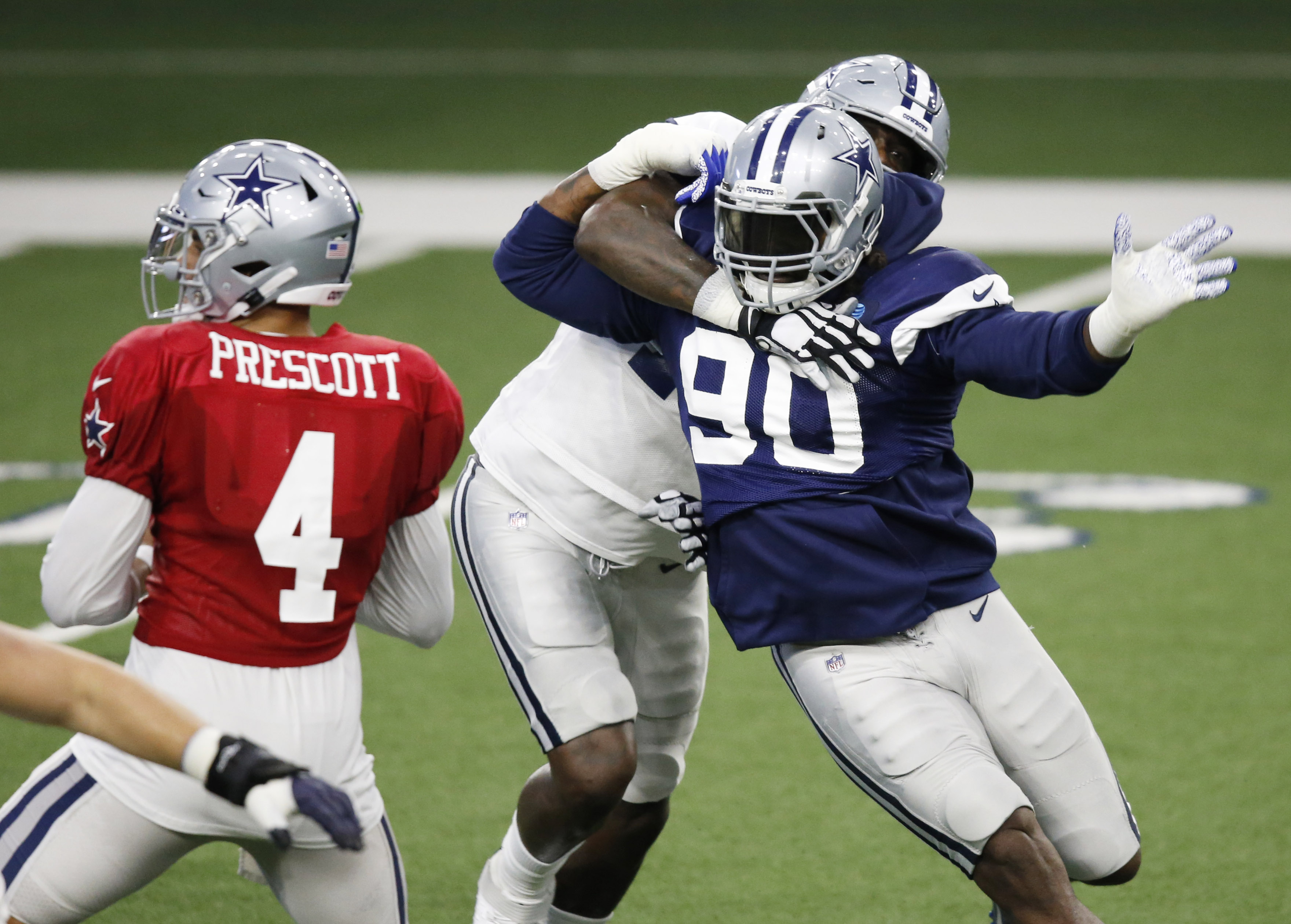 Cowboys add cap space with DeMarcus Lawrence, Tyron Smith
