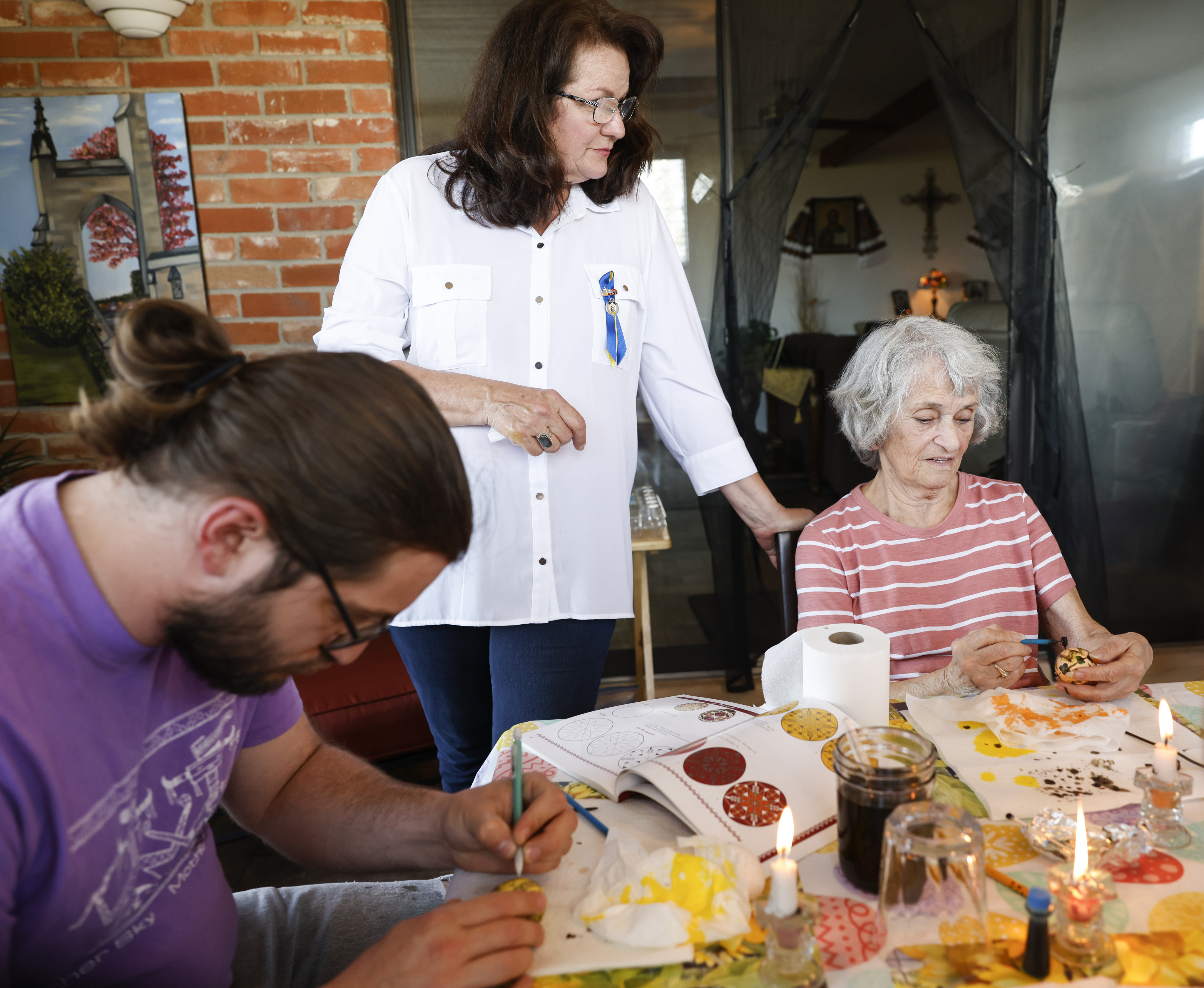 Lviv, Ukraine. 06th Apr, 2023. A young woman makes Easter eggs. A young  woman in traditional Ukrainian clothing makes Easter eggs using ancient  technology. Pysanka is an ancient tradition, one of the