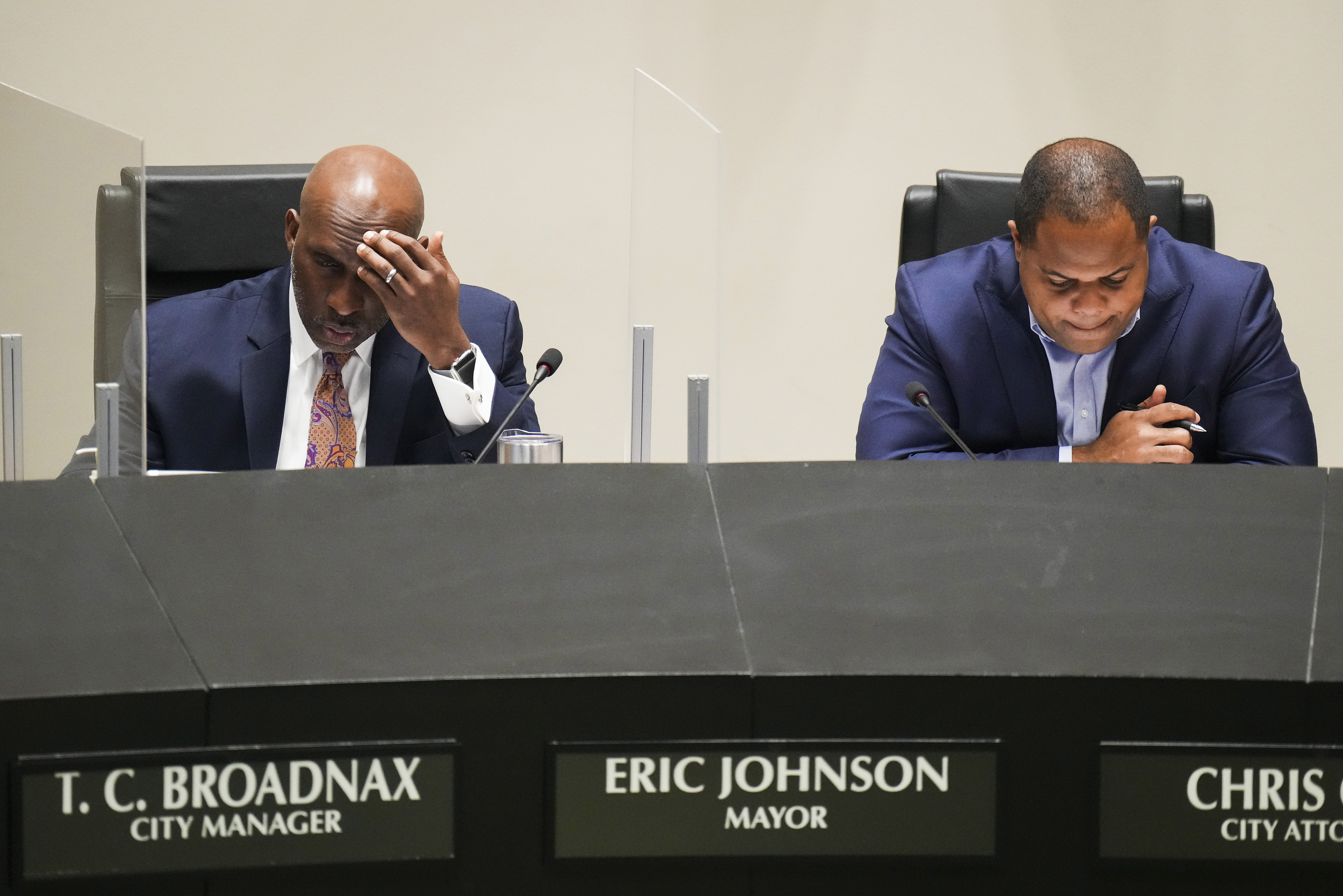 Dallas City Manager T.C. Broadnax (left) and Mayor Eric Johnson listen to public comment...