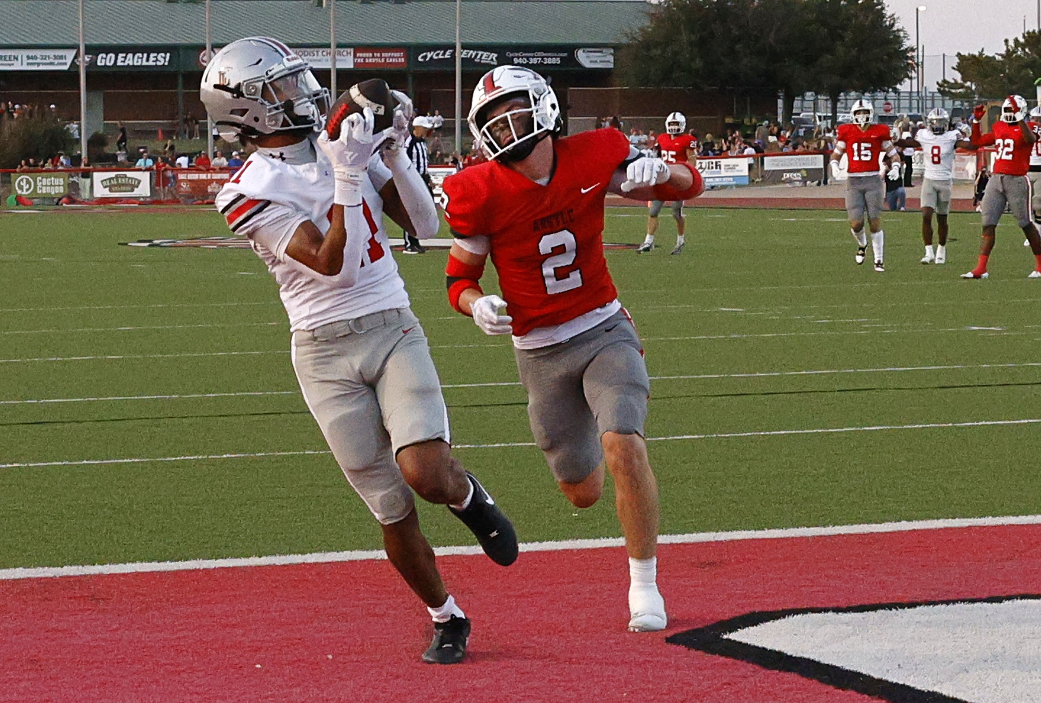 Lovejoy's Daylan McCutcheon (11) catches a pass and runs into the end zone for a touchdown...