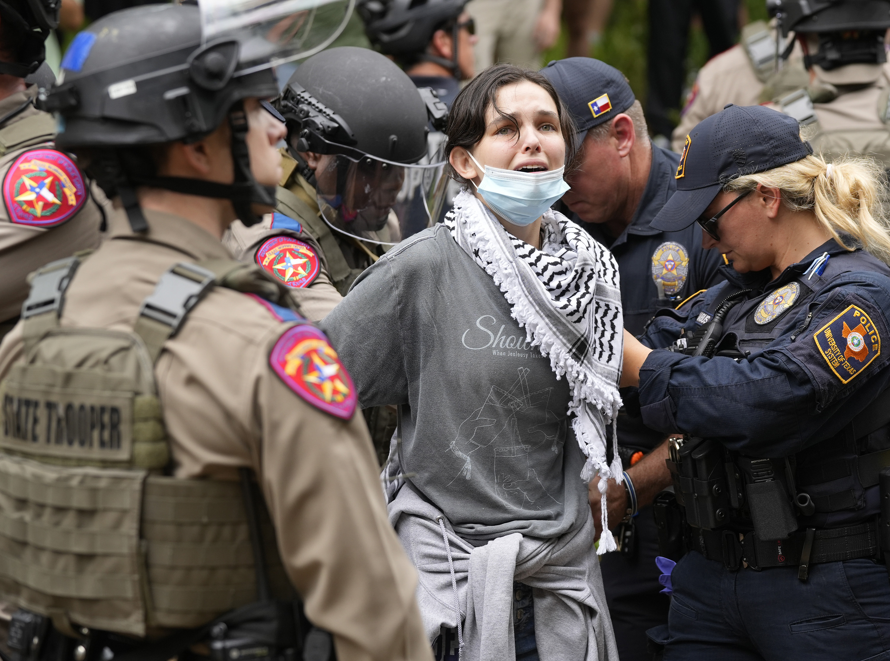 A woman is arrested at a pro-Palestinan protest at the University of Texas, Wednesday, April...