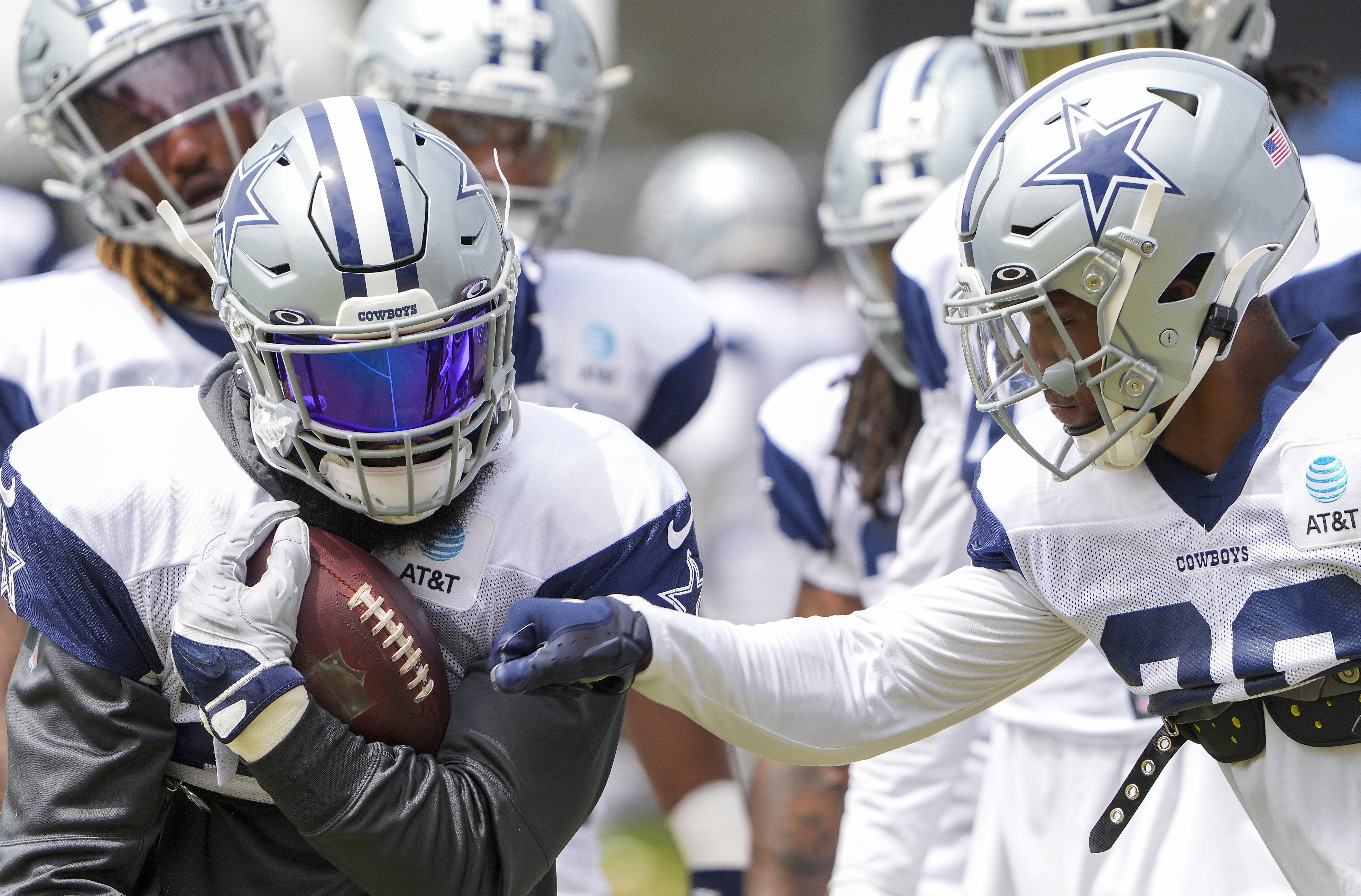 Dallas Cowboys quarterback Dak Prescott, center, has a conversation with  teammates defensive end DeMarcus Lawrence, left, linebacker Micah Parsons  during the NFL football team's training camp Saturday, July 29, 2023, in  Oxnard