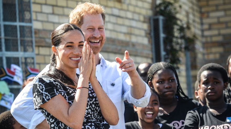 Prince Harry, Duke of Sussex and Meghan, Duchess of Sussex arrive to visit the "Justice desk", an NGO in the township of Nyanga in Cape Town, as they begin their tour of the region on September 23, 2019. - Britain's Prince Harry and his wife Meghan arrived in South Africa on September 23, launching their first official family visit in the coastal city of Cape Town. The 10-day trip began with an education workshop in Nyanga, a township crippled by gang violence and crime that sits on the outskirts of the city. (Photo by Courtney AFRICA / POOL / AFP)