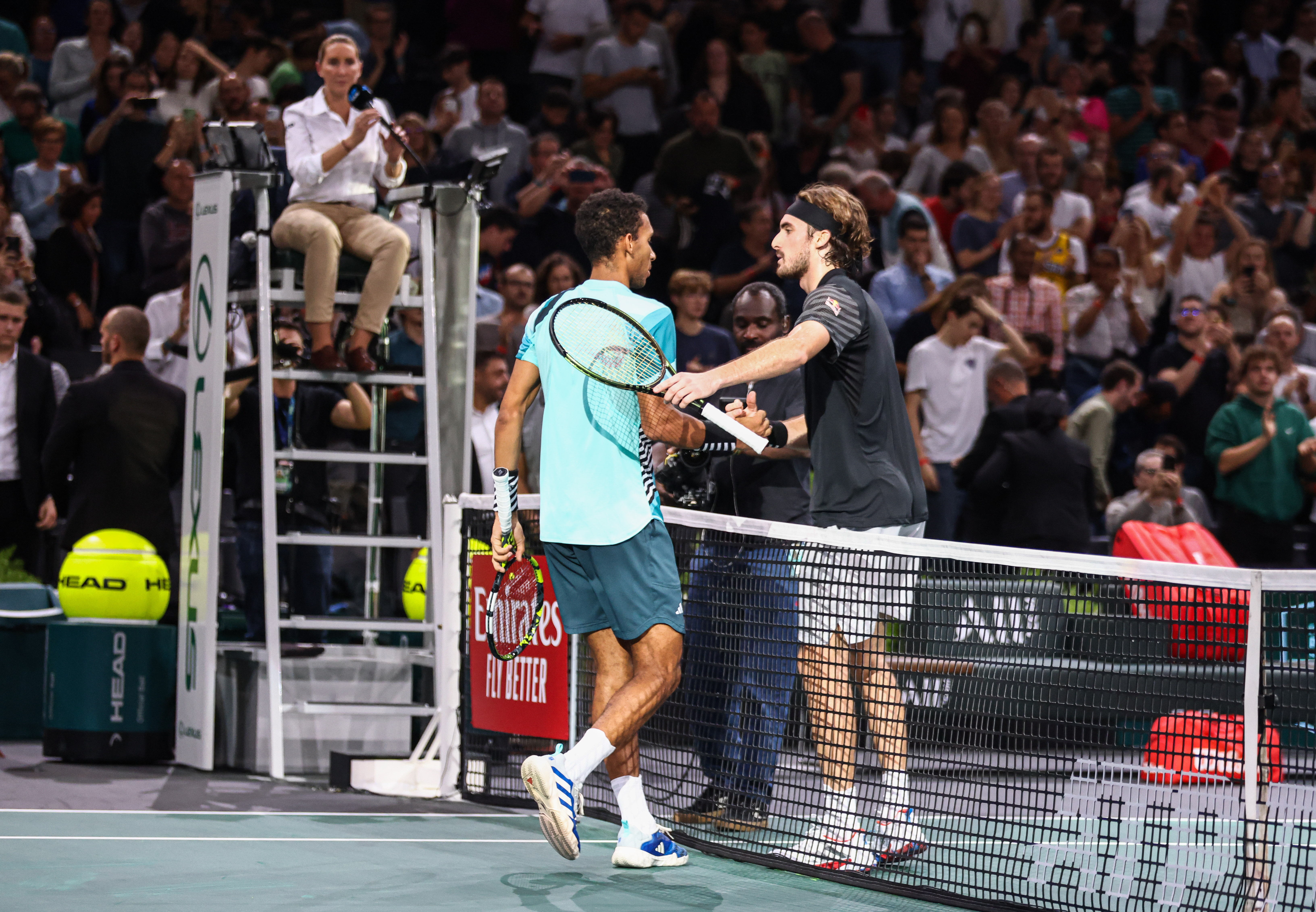 Paris (France), 01/11/2023.- Stefanos Tsitsipas of Greecev (R) shakes hands with Felix Auger-Aliassime of Canada (L) after winning their second round match at the Paris Masters tennis tournament in Paris, France, 01 November 2023. (Tenis, Francia, Grecia) EFE/EPA/Mohammed Badra