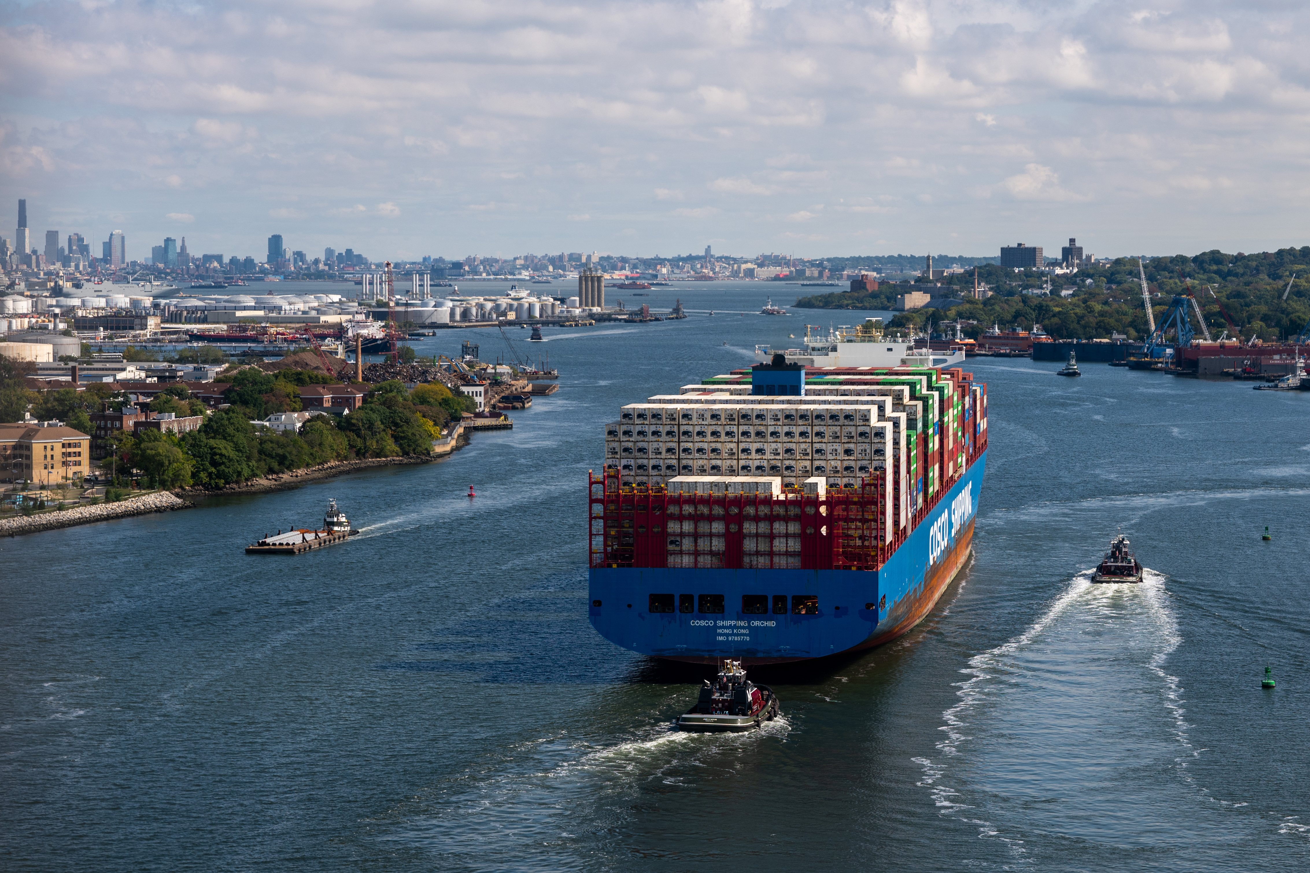 A container ship departs the Port of Newark for the Atlantic Ocean.