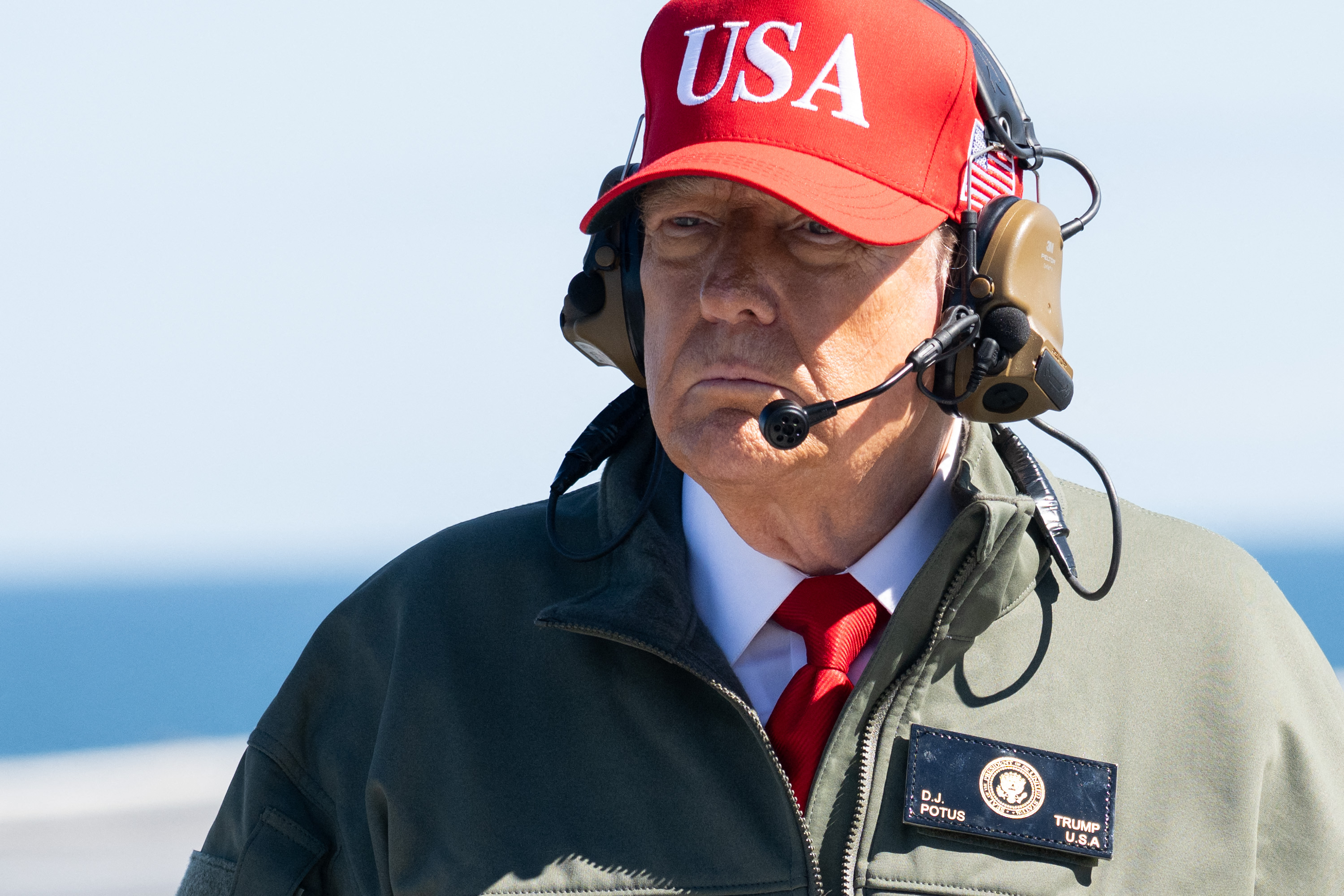 TOPSHOT - US President Donald Trump visits the USS George H.W. Bush aircraft carrier which is out at sea near Norfolk, Virginia, October 5, 2025, as he travels to see a Naval demonstration as part of the US Navy's 250th anniversary celebration, "America's Navy 250: Titans of the Sea - A Salute to the Fleet".