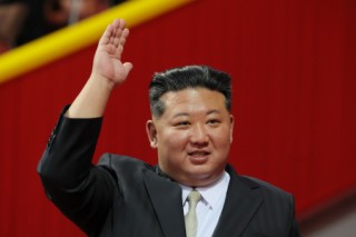 In this pool photograph distributed by the Russian state agency Sputnik, North Korean leader Kim Jong Un waves during an event marking the 80th anniversary of the founding of the Workers' Party of Korea in Pyongyang on October 9, 2025.