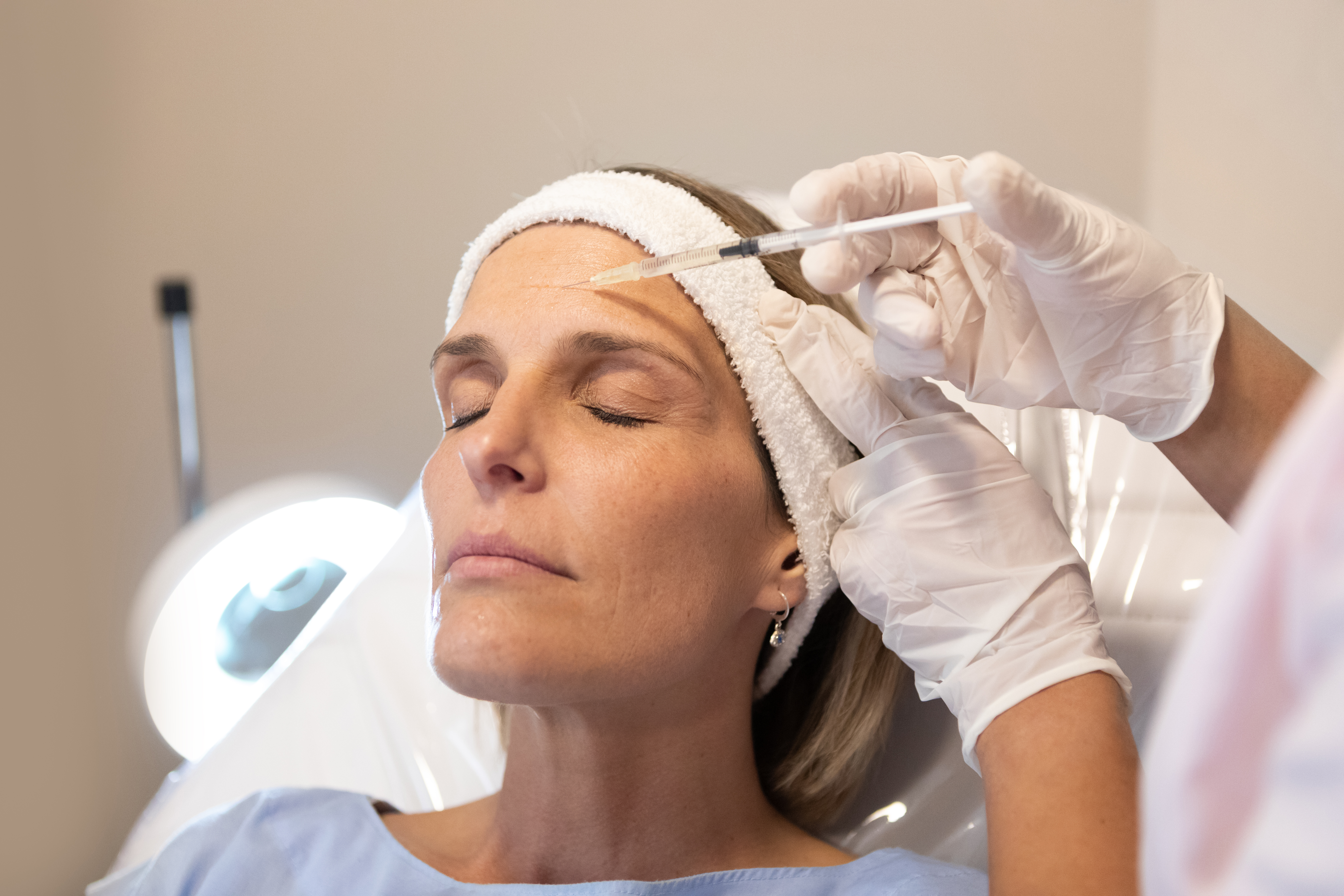 Dermatologist and beautician applying mesotherapy injections on patient - Buenos Aires - Argentina