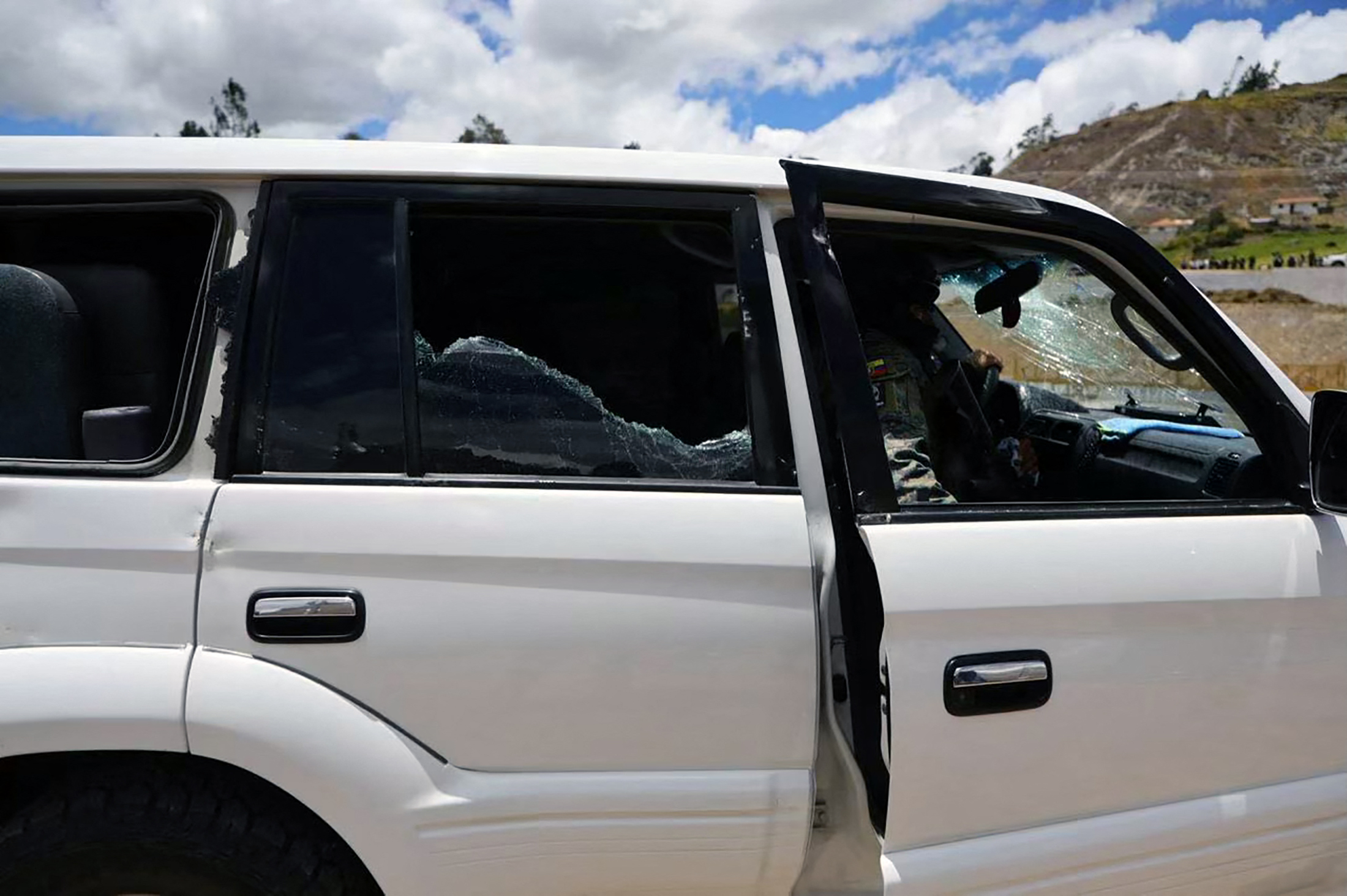 This handout picture released by the Ecuadorian Presidency shows one of the vehicles in the motorcade carrying Ecuador's President Daniel Noboa, which was attacked by gunfire in Cañar, Ecuador, on October 7, 2025.