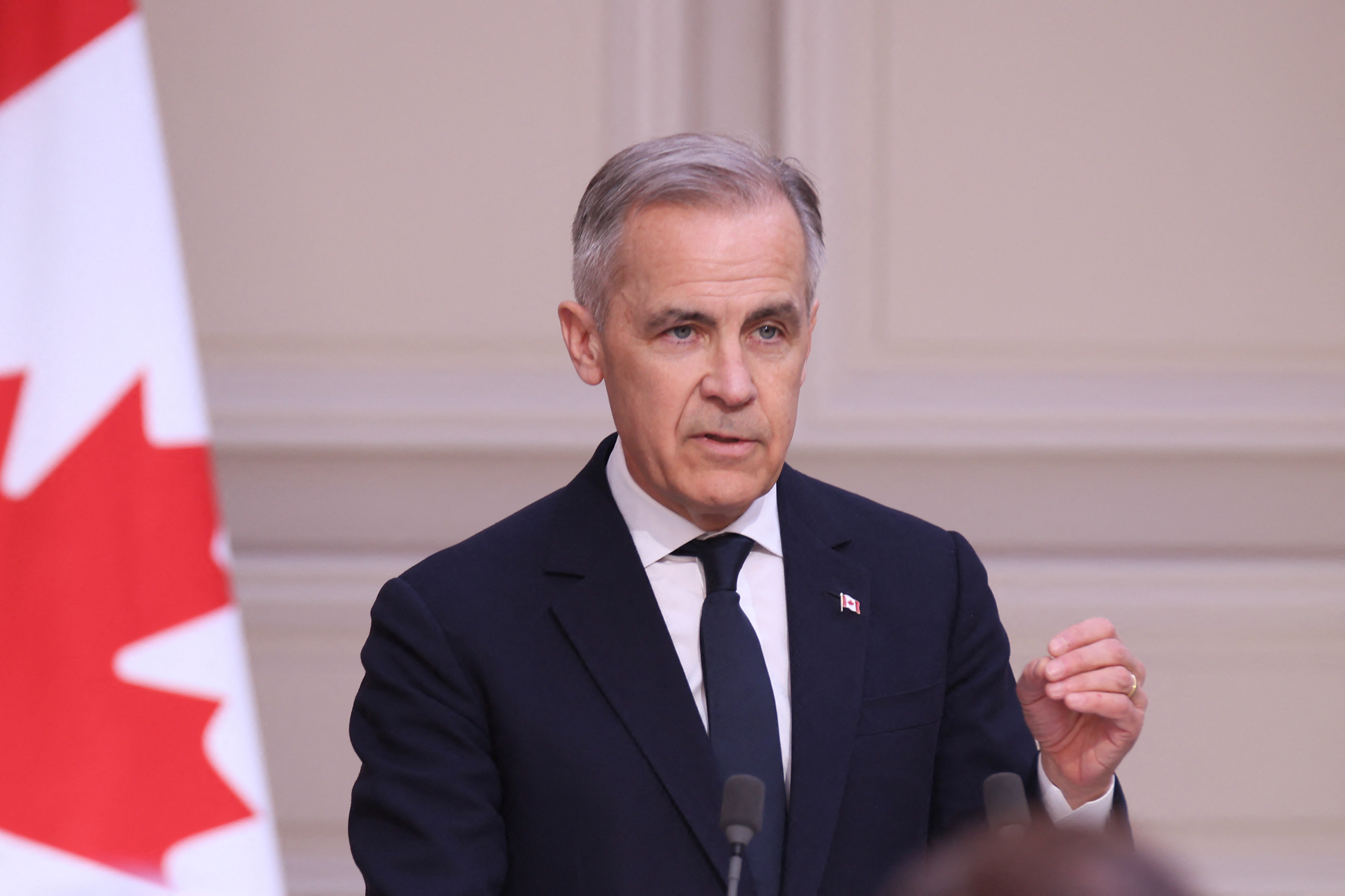 Canada's newly appointed Prime Minister Mark Carney speaks during a joint statement with France's President at the Elysee presidential palace as part of his trans-Atlantic trip to strengthen ties with traditional friends France and Britain, in Paris on March 17, 2025.