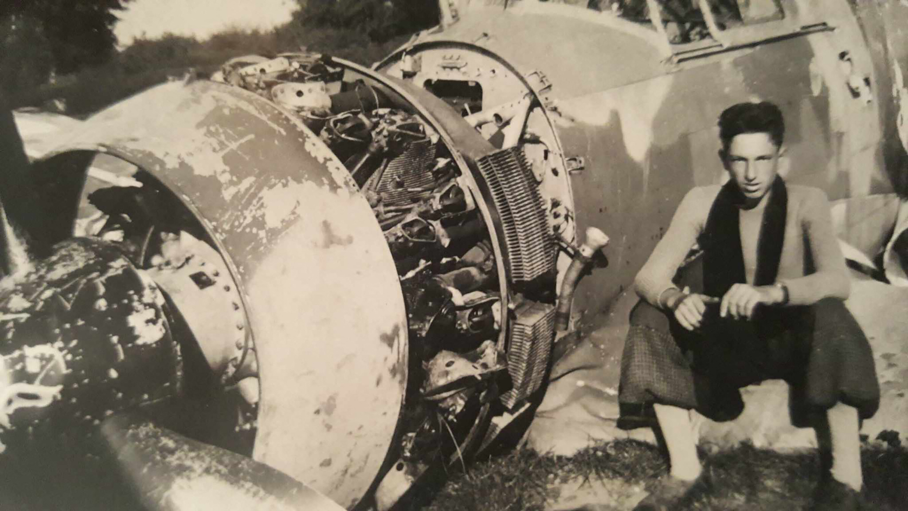 CORRECTION / This handout picture taken in 1940, courtesy of Caillet's family, shows World War II French Resistance fighter Jean Caillet posing next to the wreckage of a French Bloch MB 152 fighter aircraft in Nesle-Hodeng, France.