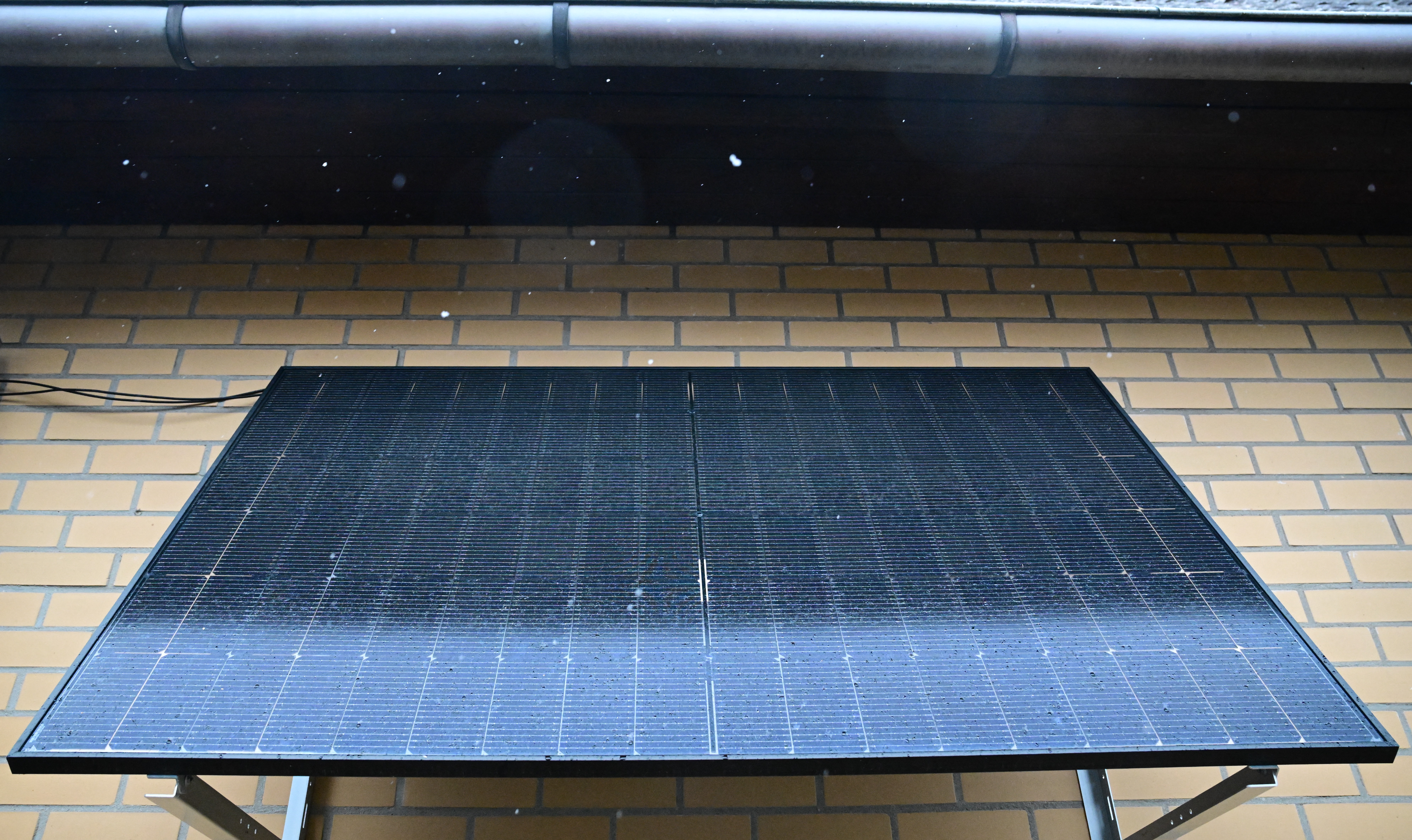 A part of a so-called balcony solar panel is pictured at a balcony of a private living house in Berlin on January 3, 2025.
