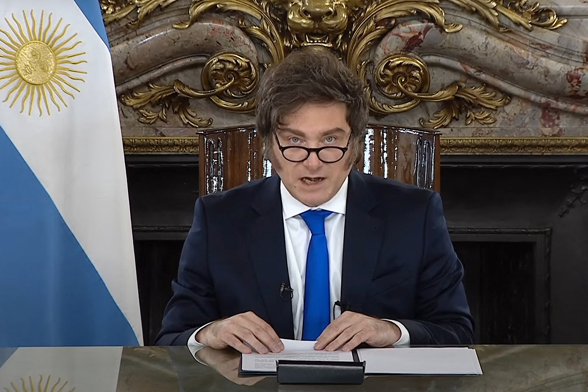This screen grab taken on August 8, 2025, from an official government TV broadcast shows Argentina's President Javier Milei announced measures to "build a wall" and protect the fiscal surplus after vetoing on Monday an increase in retirement and disability pensions approved by Congress. (Photo by Argentina's Presidency Press Office / AFP) / RESTRICTED TO EDITORIAL USE - MANDATORY CREDIT "AFP PHOTO / ARGENTINA'S PRESIDENCY" - NO MARKETING NO ADVERTISING CAMPAIGNS - DISTRIBUTED AS A SERVICE TO CLIENTS