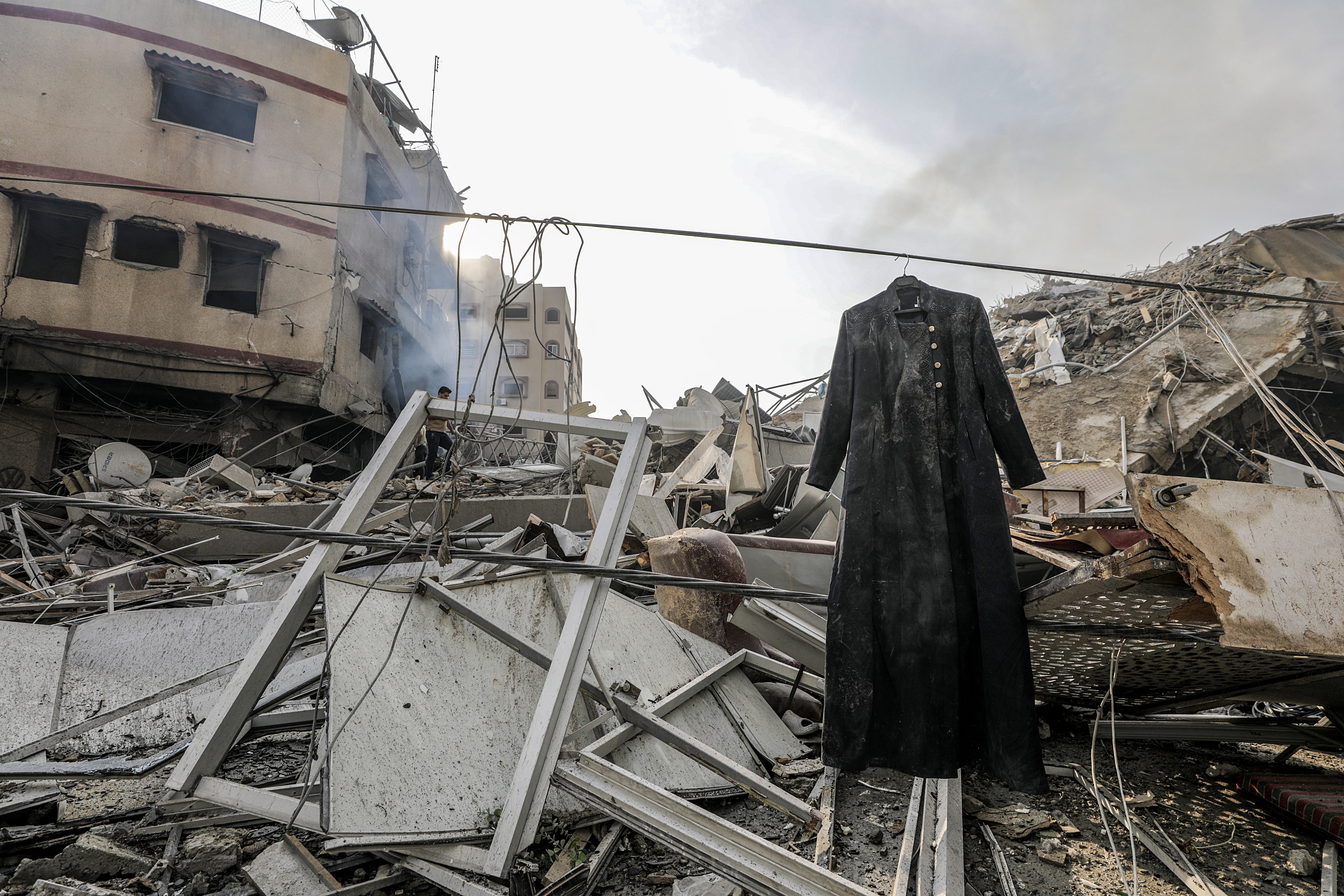 Gaza (---), 08/10/2023.- A coat hangs beside the rubble at the site of the destroyed Al-Watan Tower following Israeli air strikes, in Gaza City, 08 October 2023. The air strikes, in retaliation for the 07 October Hamas rocket attacks on Israel, have killed over 300 people in the Gaza Strip, with almost 2,000 wounded, according to Palestinian official sources. EFE/EPA/MOHAMMED SABER