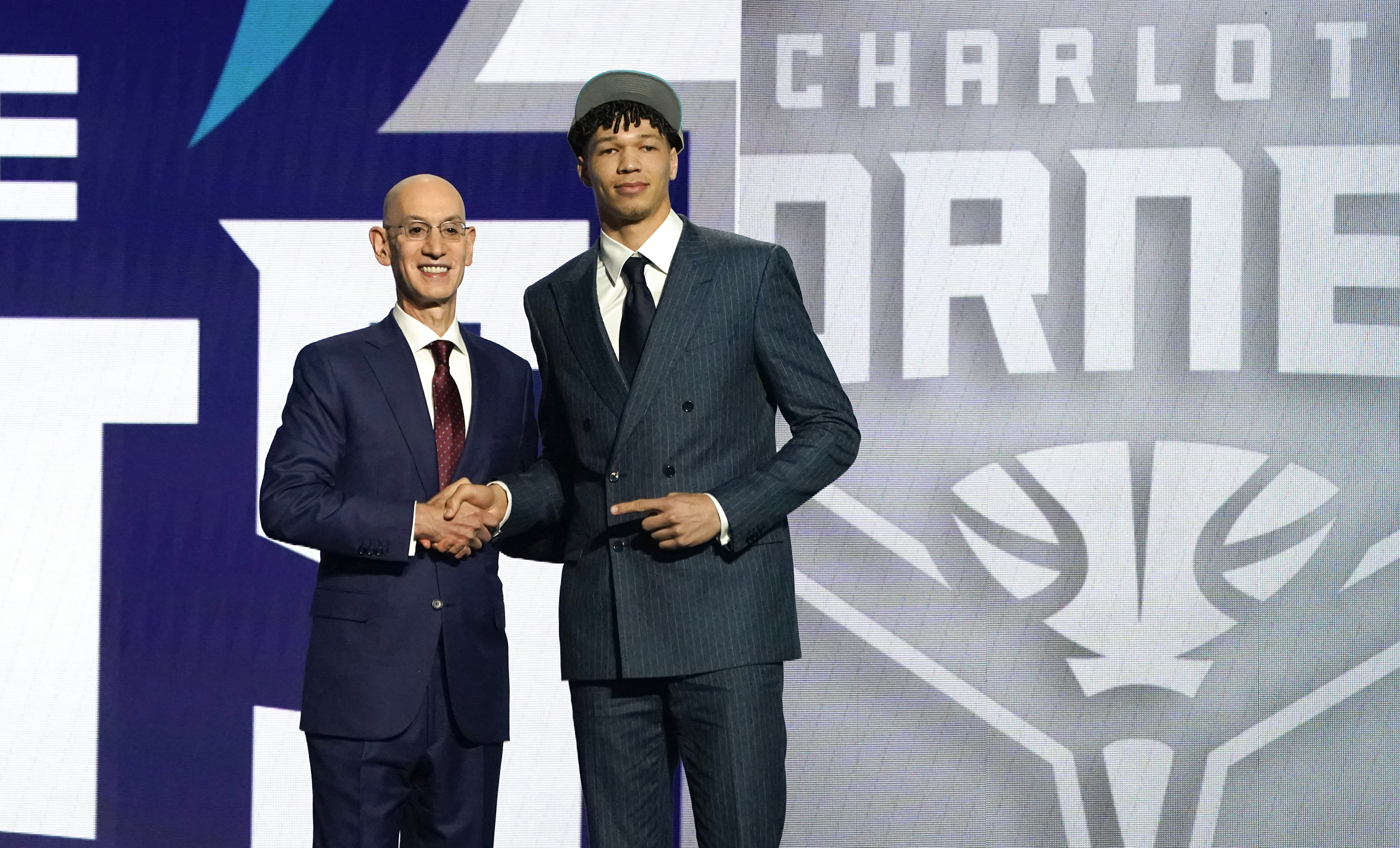 Adam Silver, Commissioner of the National Basketball Association (NBA), poses with French basketball player Tidjane Salaun (R) during Round One of the 78th edition of the NBA's annual draft at Barclays Center in Brooklyn, on June 26, 2024.